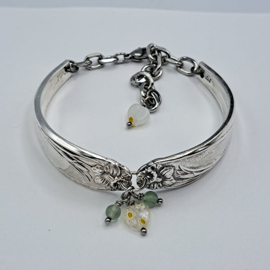 Handmade vintage silverware bracelet made from Daffodil 1950 pattern silverplated handles with center charm
