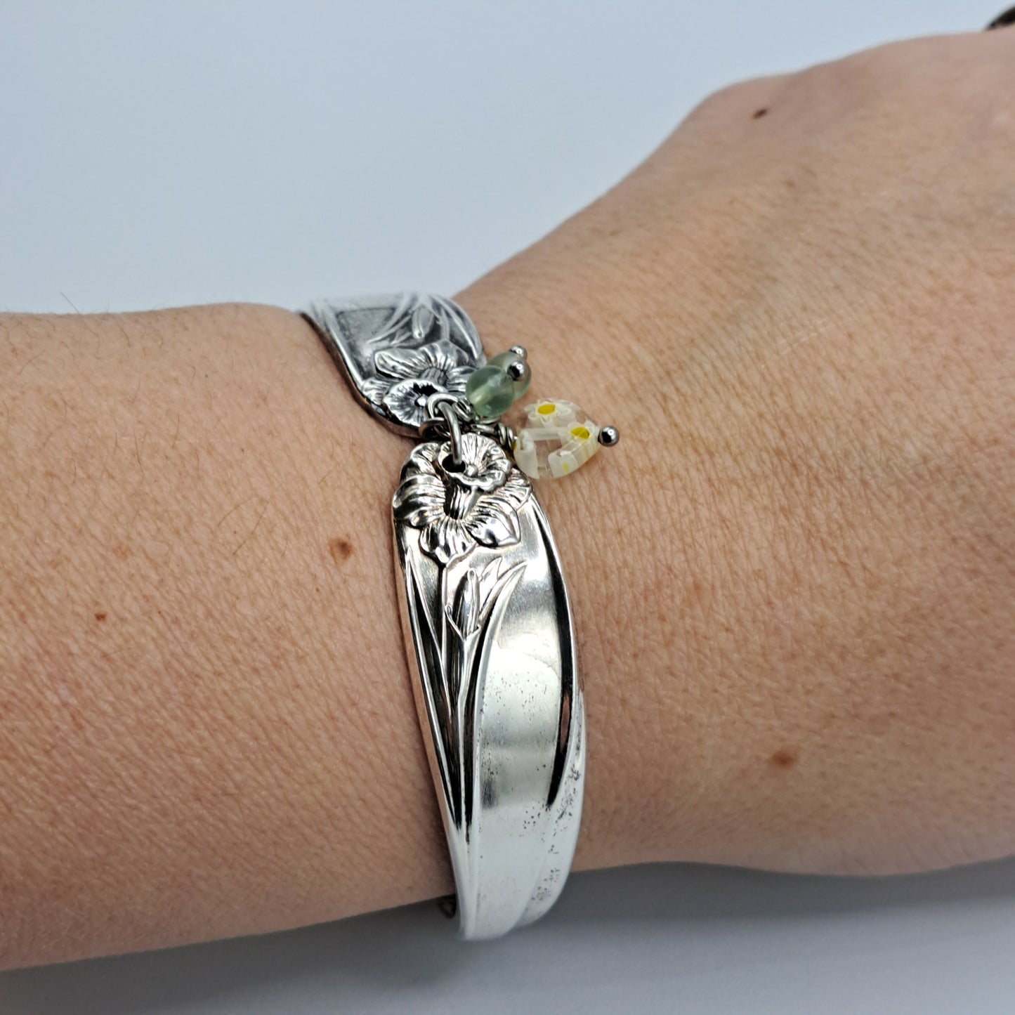 Handmade vintage silverware bracelet made from Daffodil 1950 pattern silverplated handles with center charm