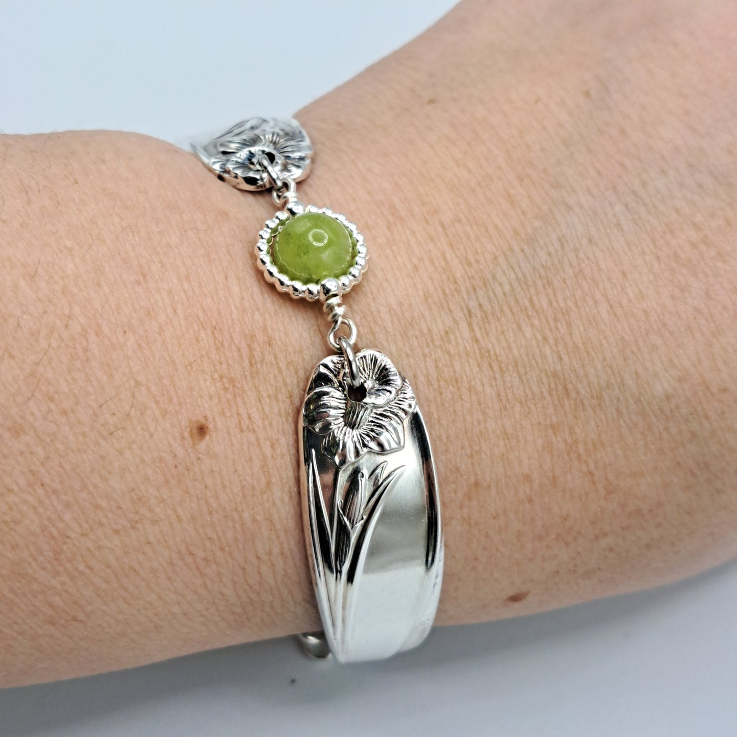 Handmade vintage silverware bracelet made from Daffodil 1950 pattern silverplated handles with center charm