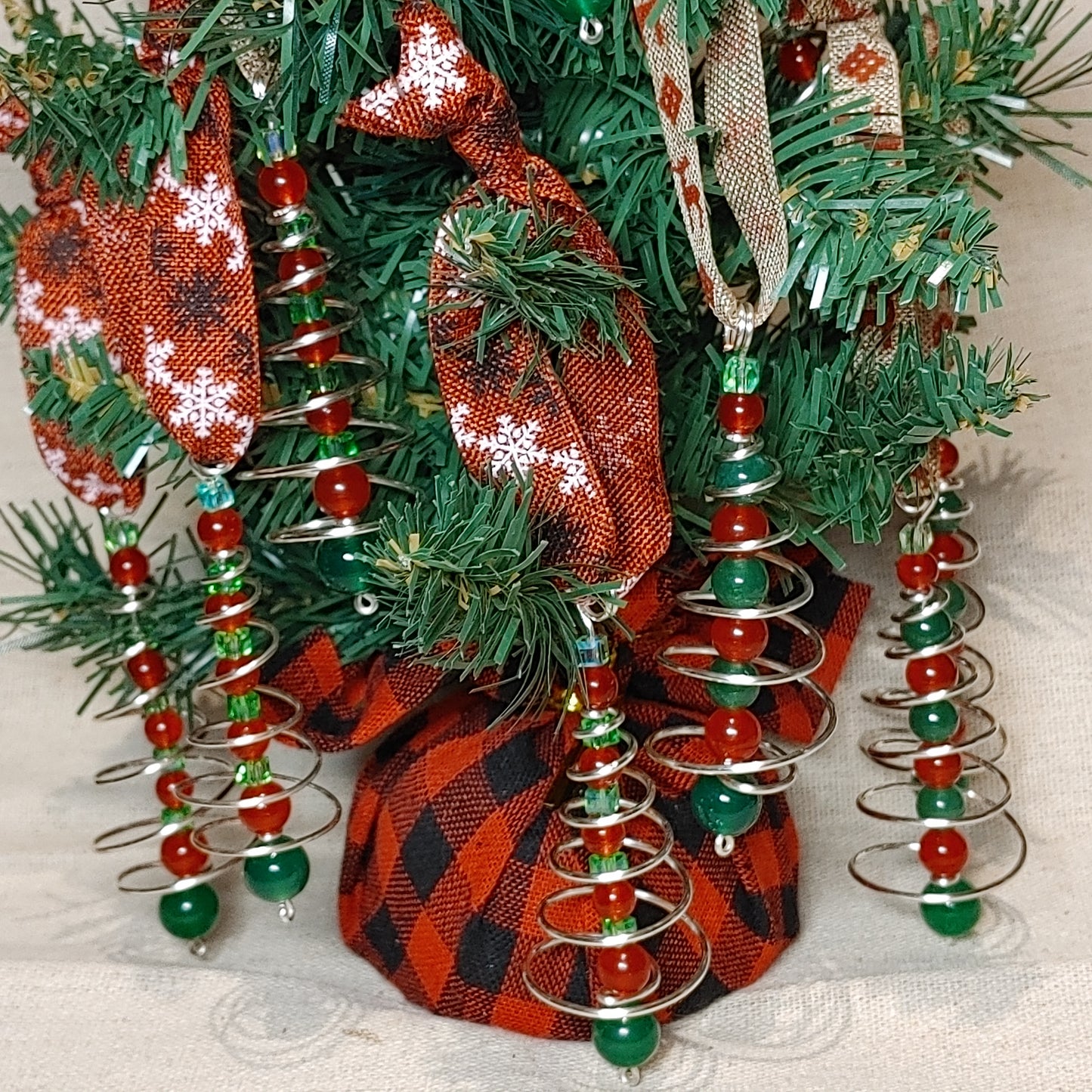 Handmade spiral wire tree with red and green beaded center christmas tree ornament