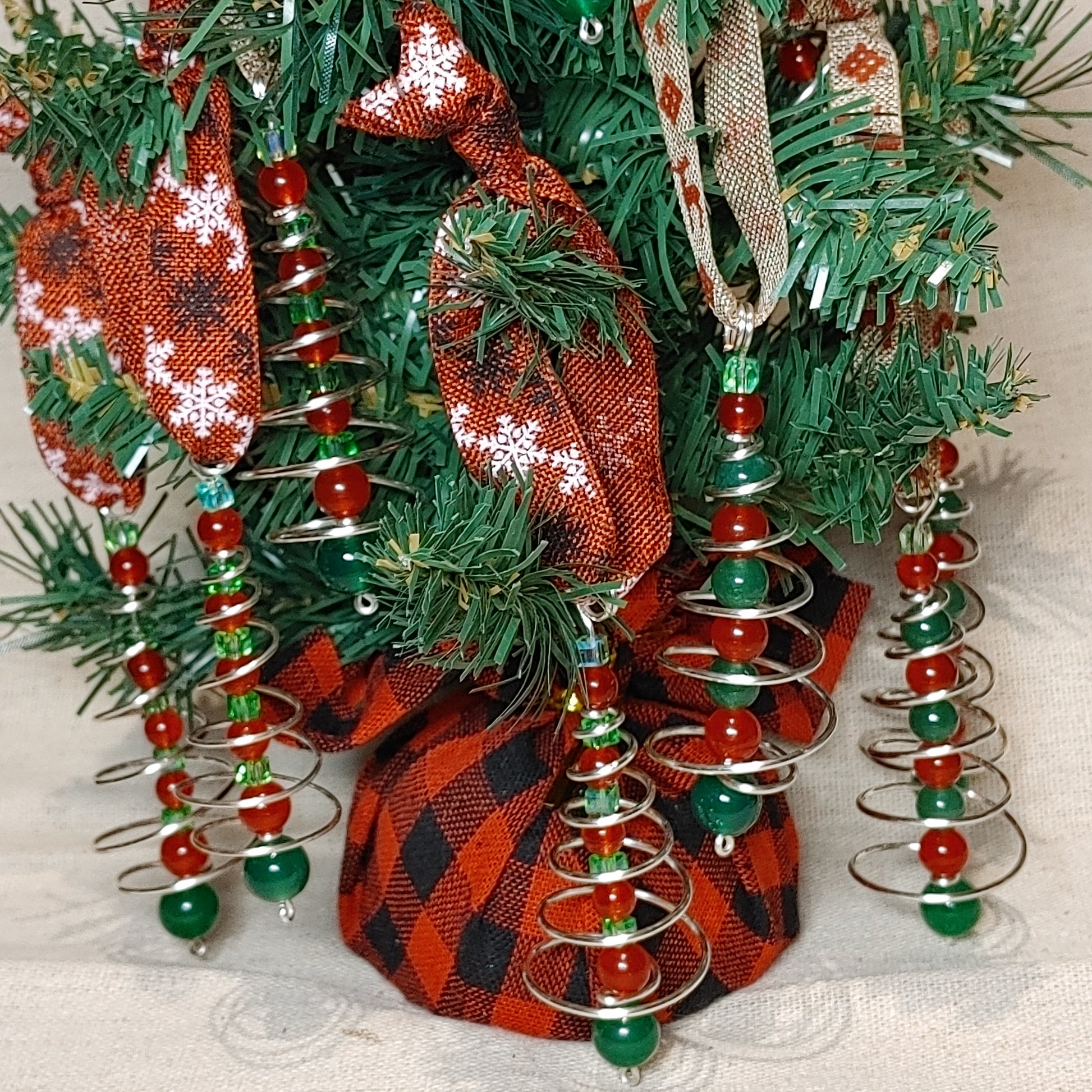 Handmade spiral wire tree with red and green beaded center christmas tree ornament