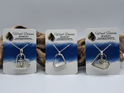 Handmade vintage silverware heart necklace made from various silverplate patterns 