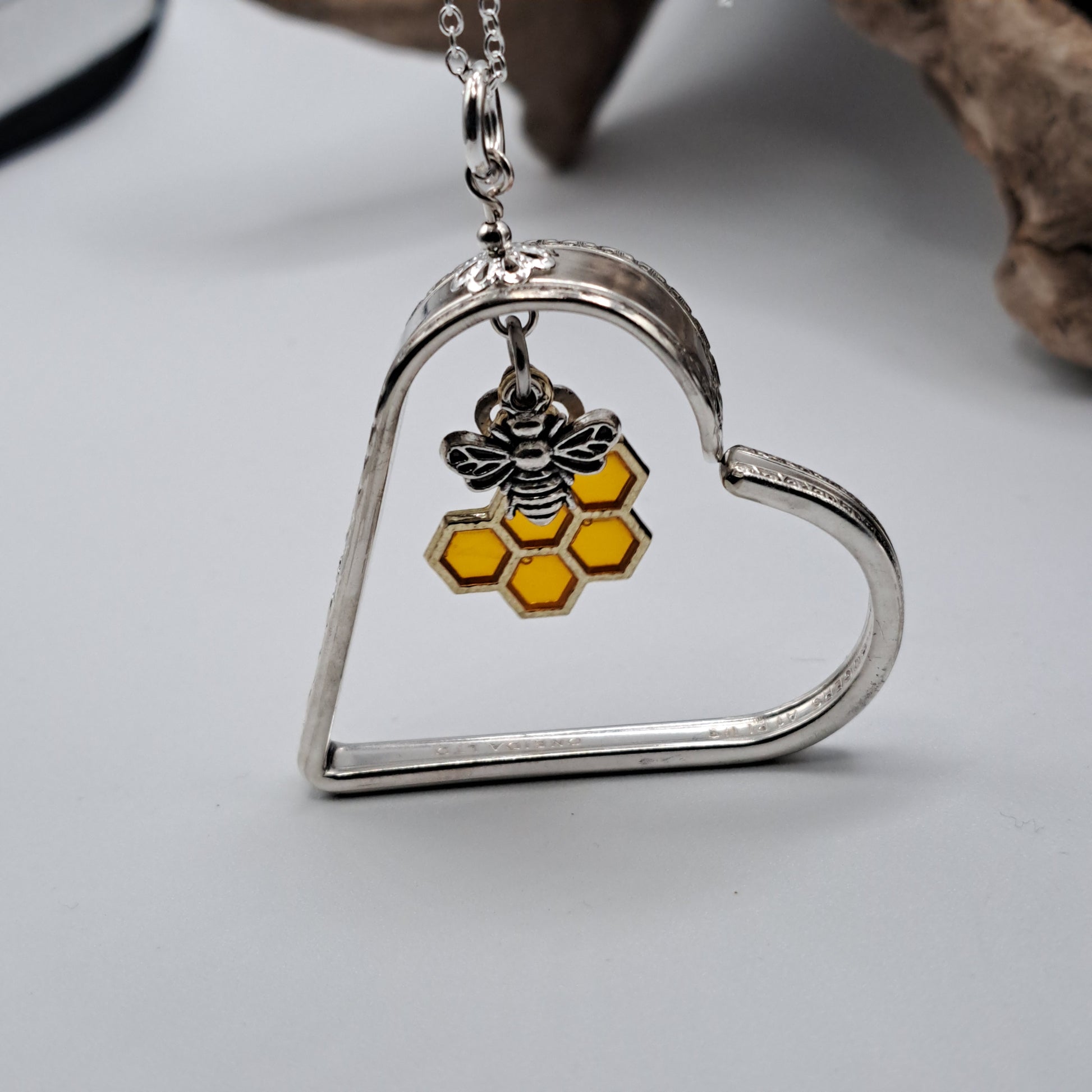 Handmade vintage silverware heart necklace made from various silverplate patterns 