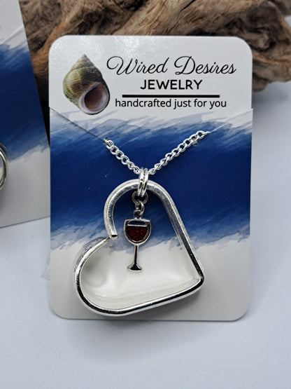Handmade vintage silverware heart necklace made from various silverplate patterns 