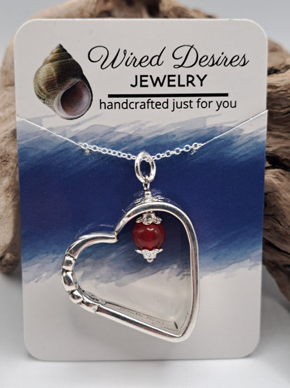 Handmade vintage silverware heart necklace made from various silverplate patterns 