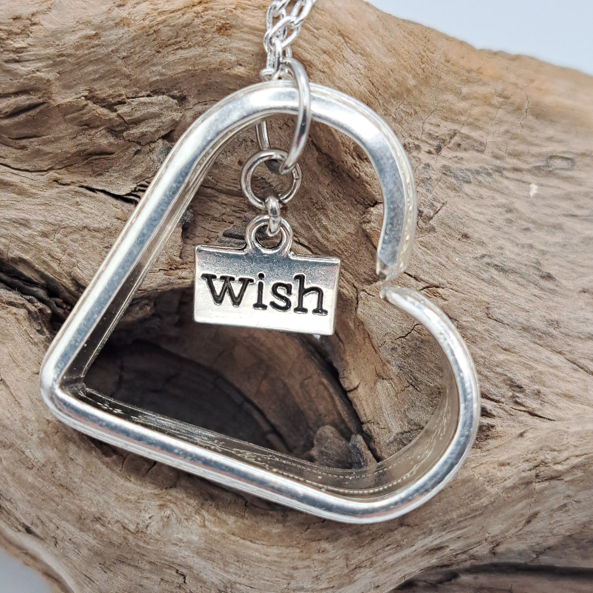 Handmade vintage silverware heart necklace made from various silverplate patterns 
