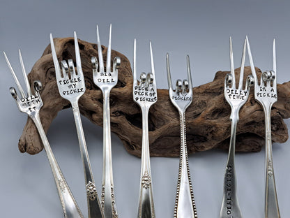 Vintage silverware forks made into pickle forks with hand-stamped expressions