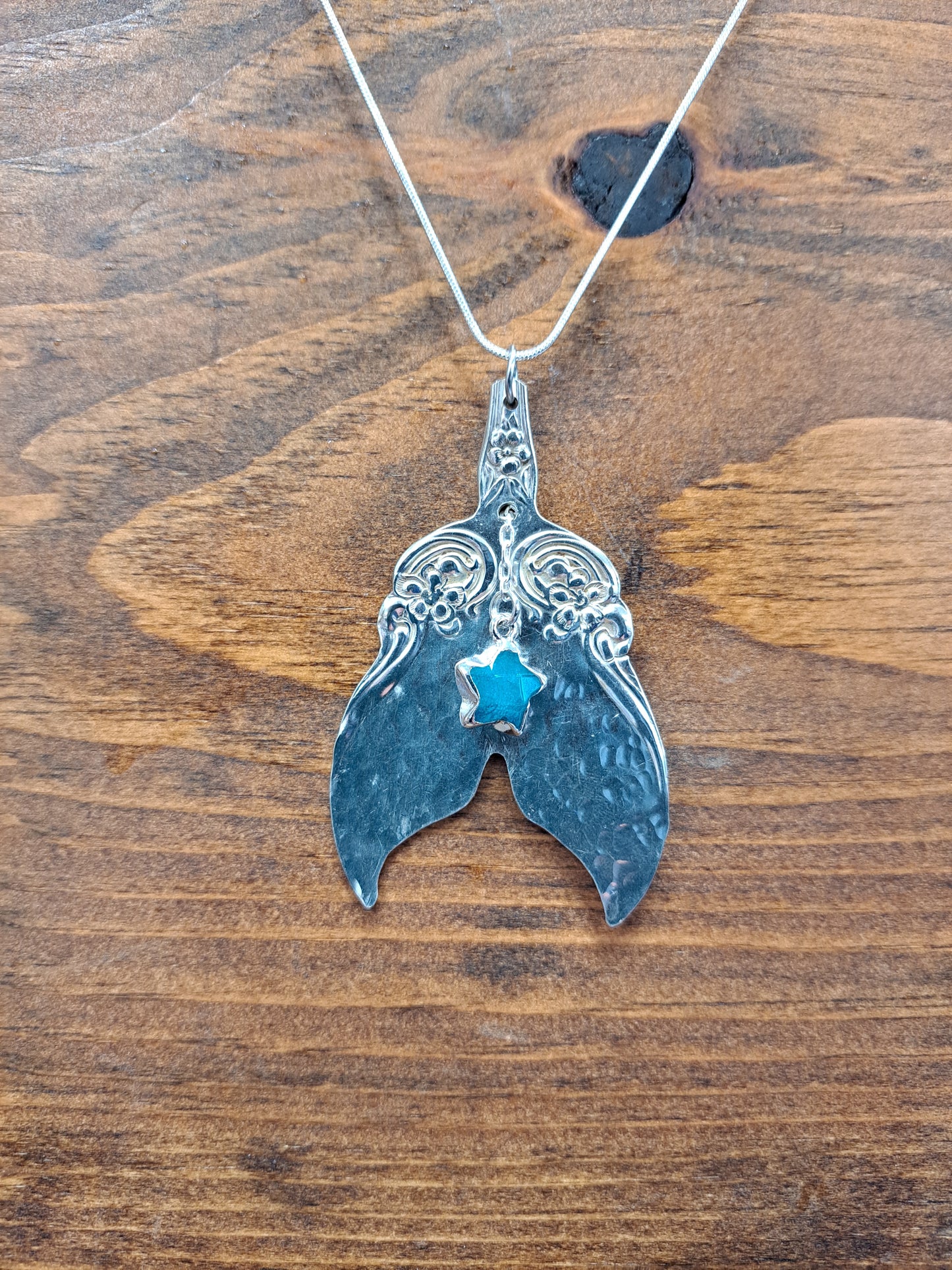 Handmade vintage silverware necklace made from Arbutus 1908 silverplate pattern shaped as a mermaid or whale tail