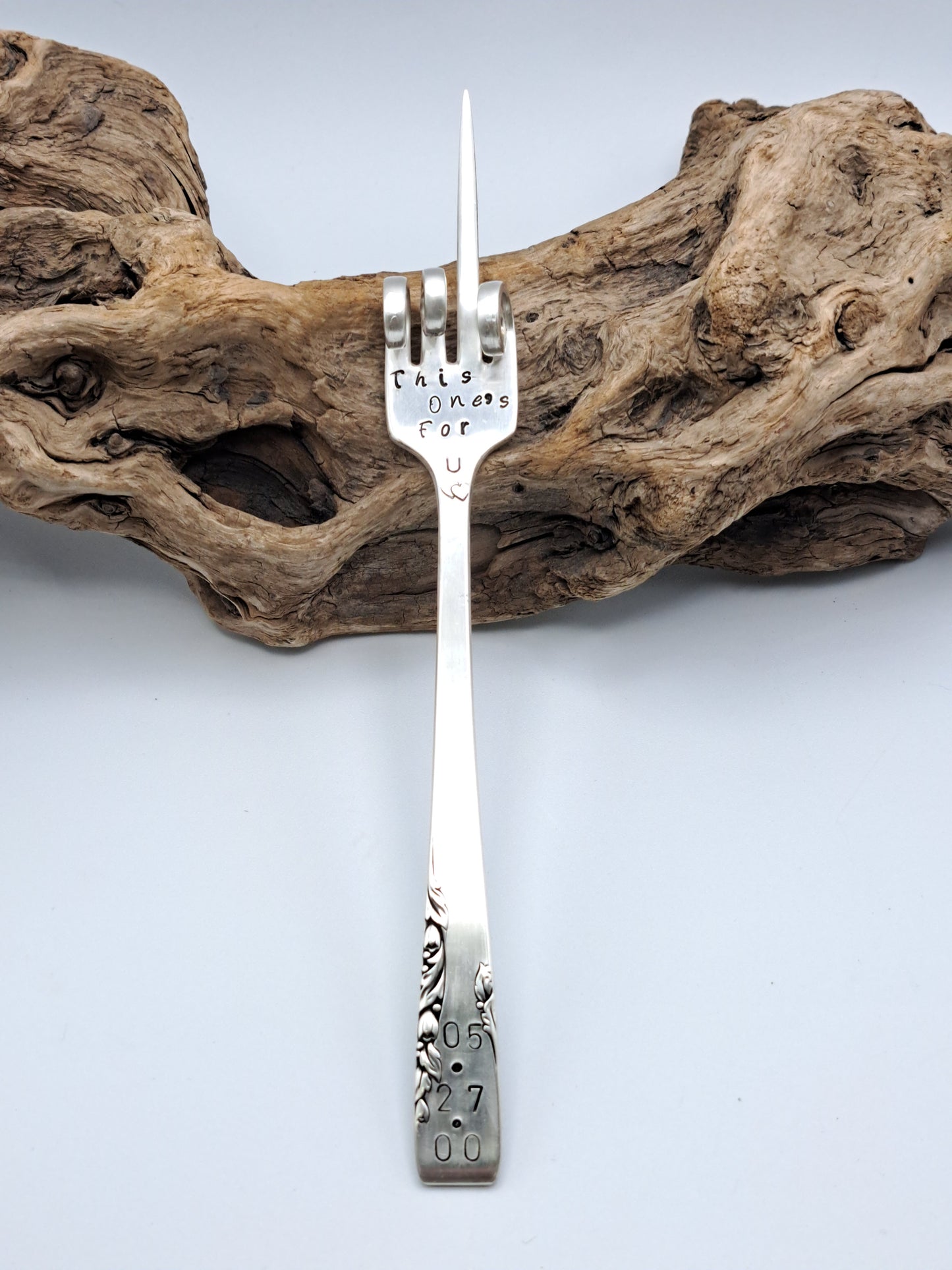 Vintage silverware forks made into pickle forks with hand-stamped expressions