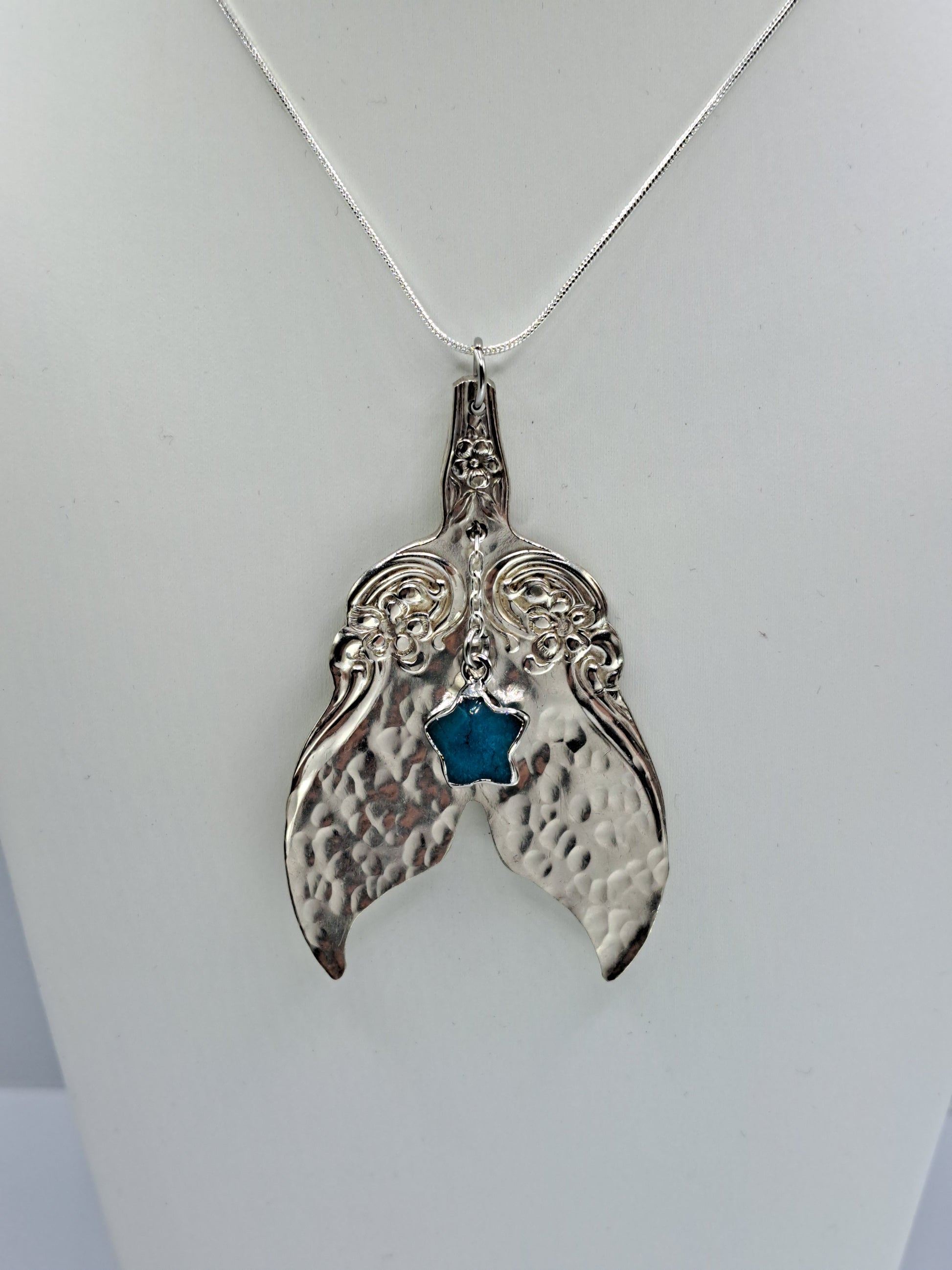 Handmade vintage silverware necklace made from Arbutus 1908 silverplate pattern shaped as a mermaid or whale tail