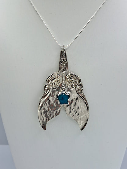 Handmade vintage silverware necklace made from Arbutus 1908 silverplate pattern shaped as a mermaid or whale tail