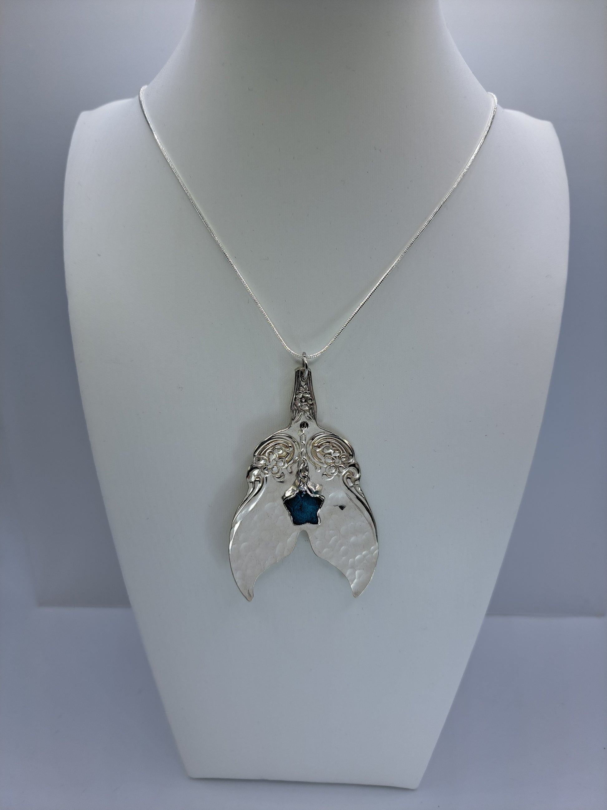 Handmade vintage silverware necklace made from Arbutus 1908 silverplate pattern shaped as a mermaid or whale tail
