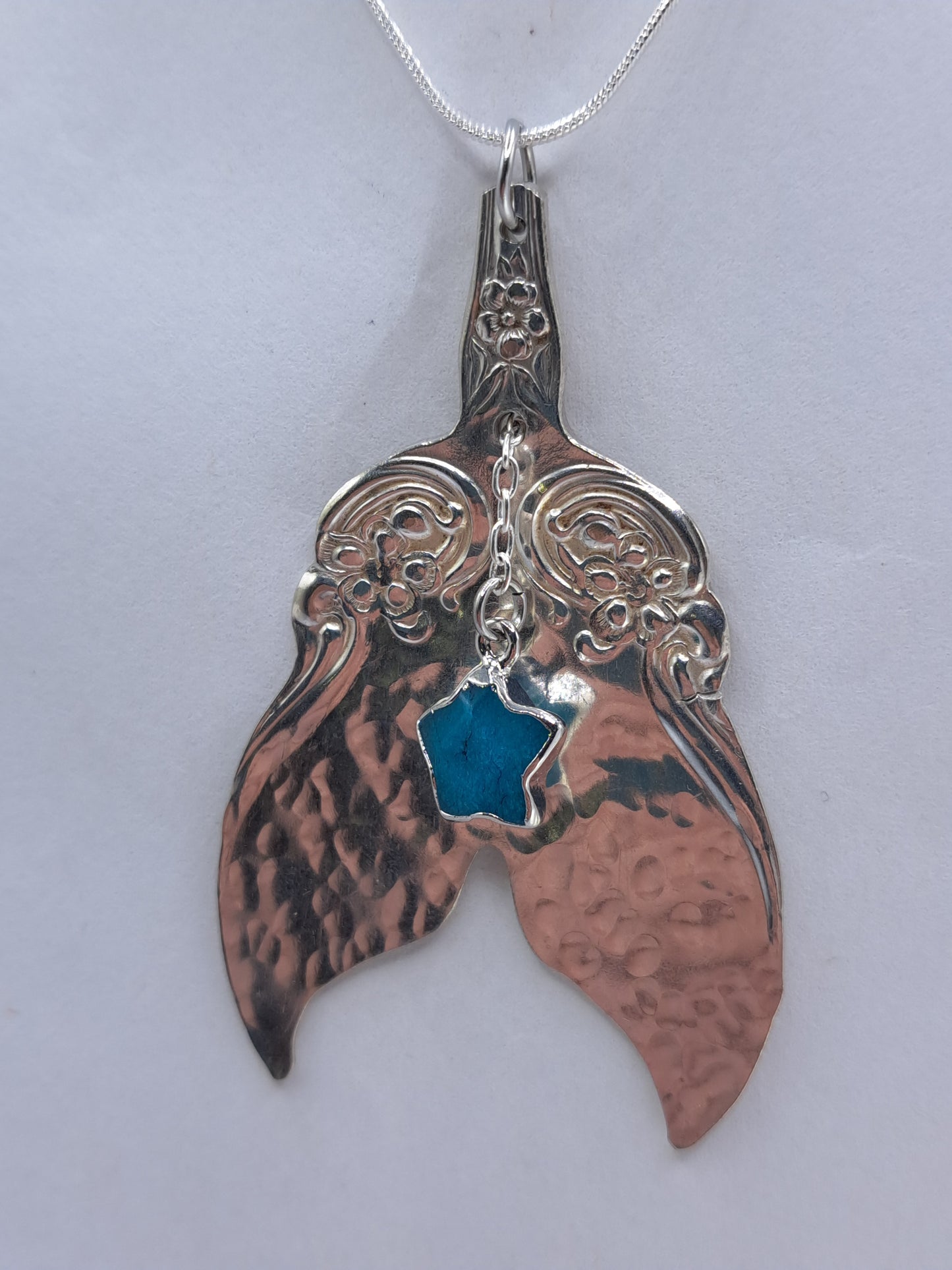Handmade vintage silverware necklace made from Arbutus 1908 silverplate pattern shaped as a mermaid or whale tail
