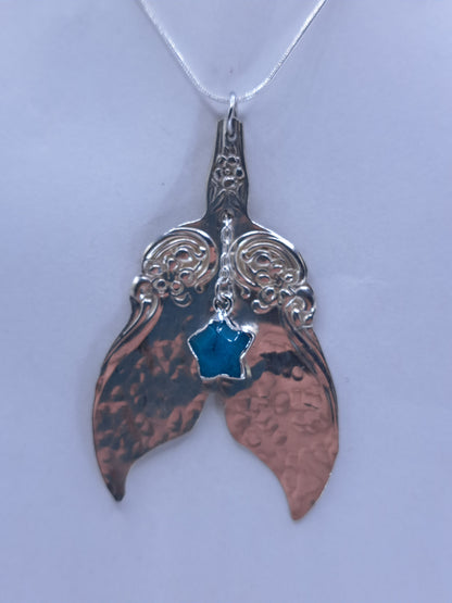 Handmade vintage silverware necklace made from Arbutus 1908 silverplate pattern shaped as a mermaid or whale tail