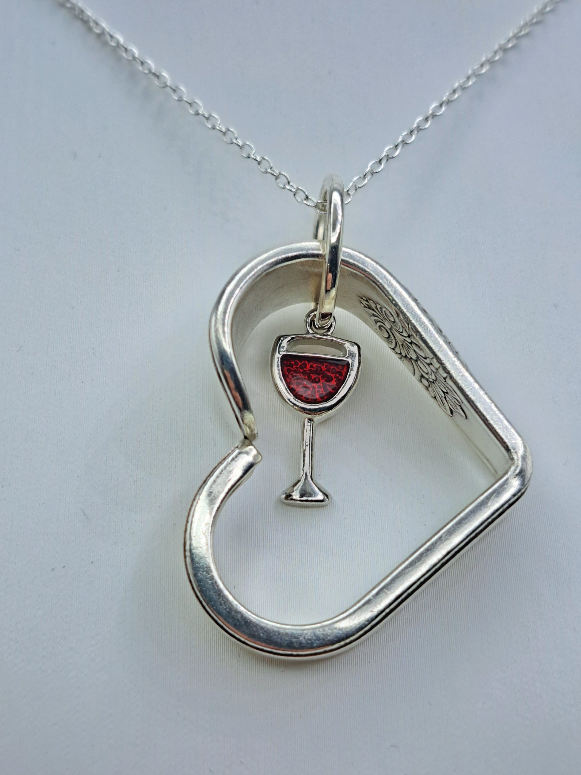 Handmade vintage silverware heart necklace made from Adoration 1930 silverplate pattern with red wine glass charm