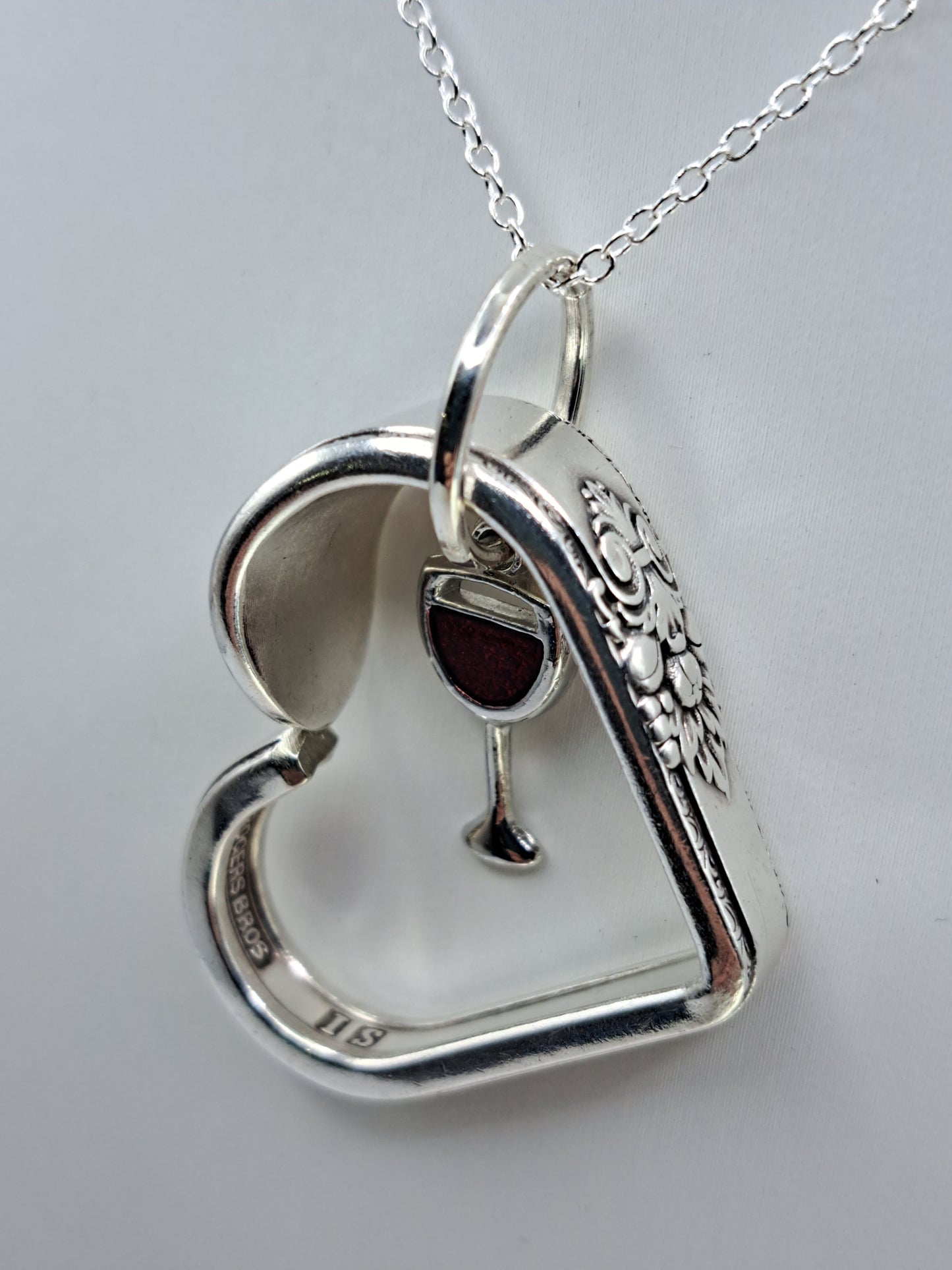 Handmade vintage silverware heart necklace made from Adoration 1930 silverplate pattern with red wine glass charm