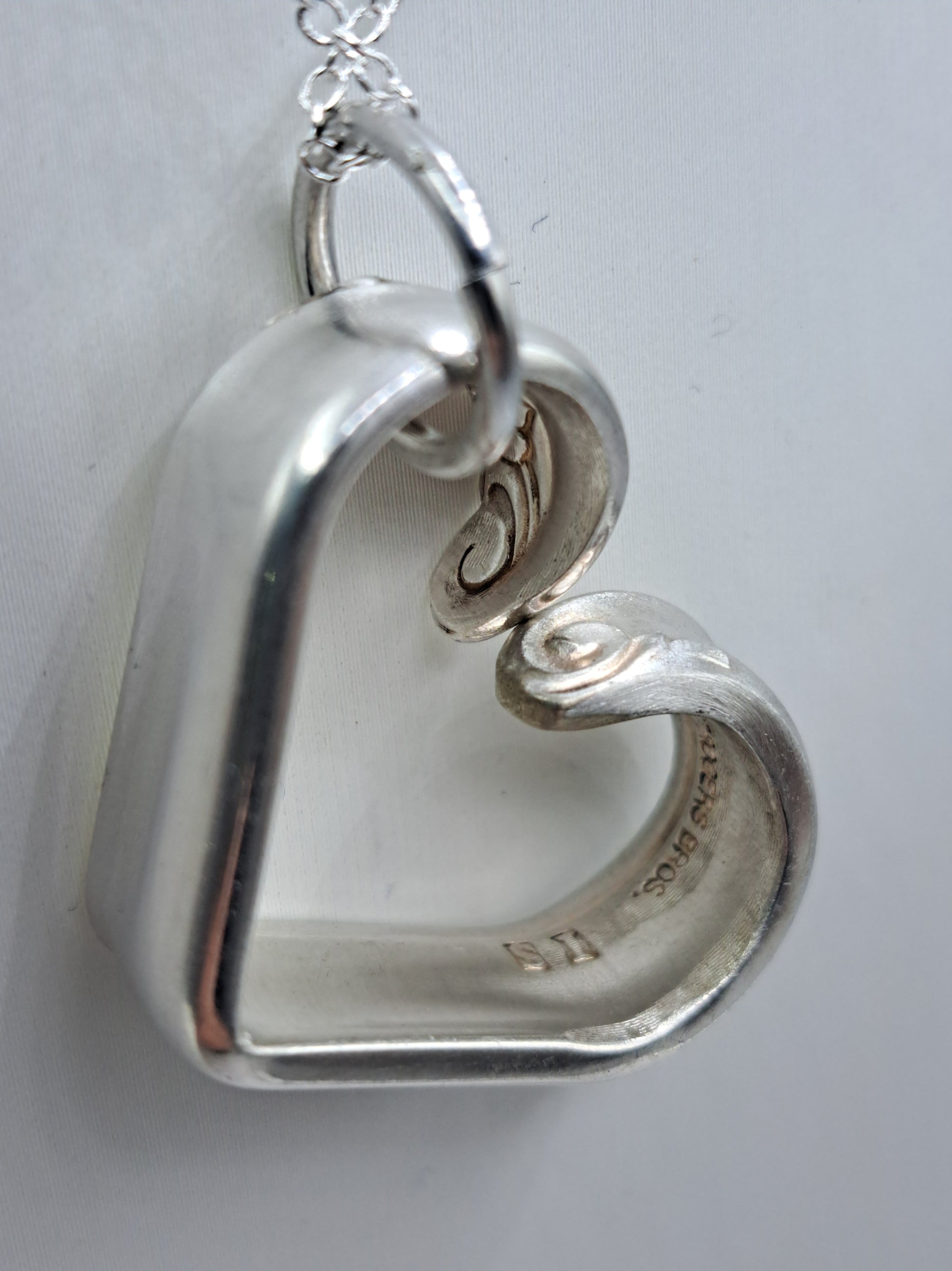 Handmade vintage silverware heart necklace made from Leilani 1961 silverplate pattern