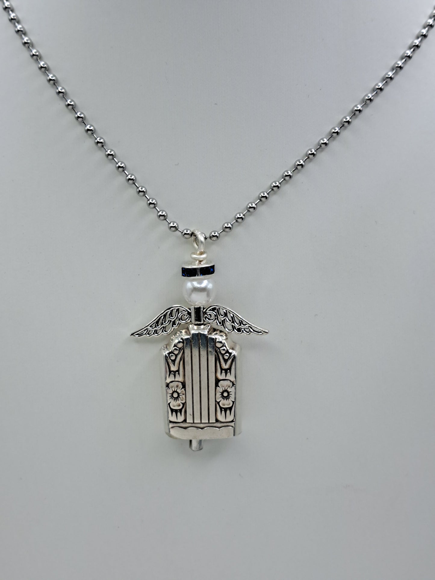 Handmade vintage silverware necklace made from Harmony 1938 silverplate into an angel bell with blue halo 