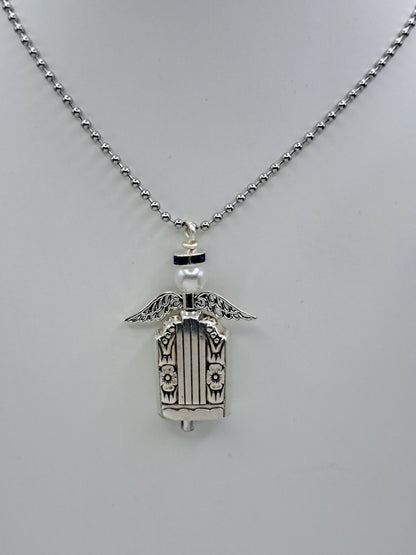 Handmade vintage silverware necklace made from Harmony 1938 silverplate into an angel bell with blue halo 