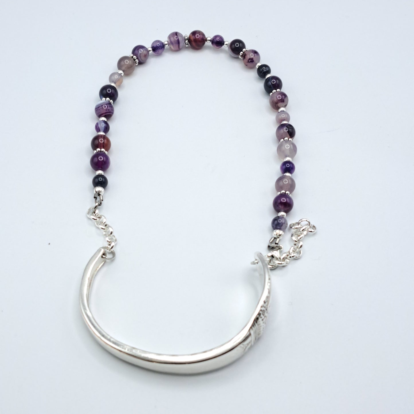Handmade vintage silverware bracelet made from First Love 1937 silverplated handles with purple marble agate gemstone beads