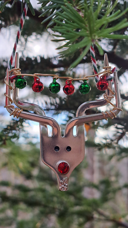 Handmade vintage silverware Christmas Ornament made from a fork shaped as a reindeer with christmas bells in antlers