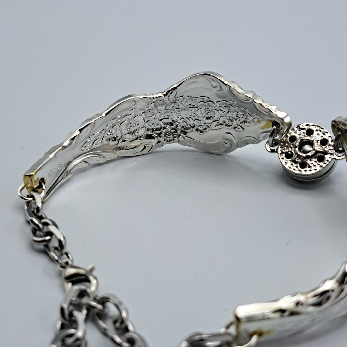 Handmade vintage silverware bracelet made from Silver Renaissance 1971 pattern silverplated handles with center snap charm