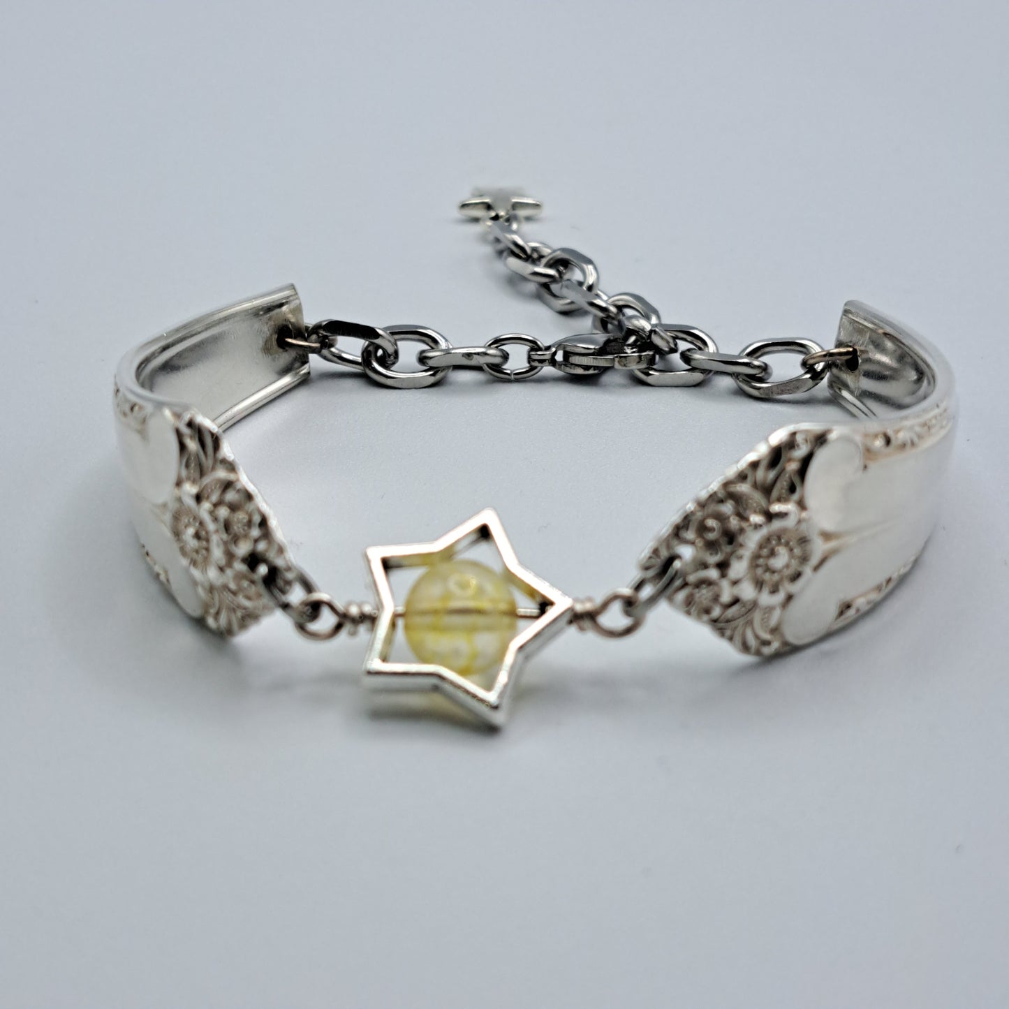 Handmade vintage silverware bracelet made from Starlight 1950 pattern silverplated handles with citrine gemstone center