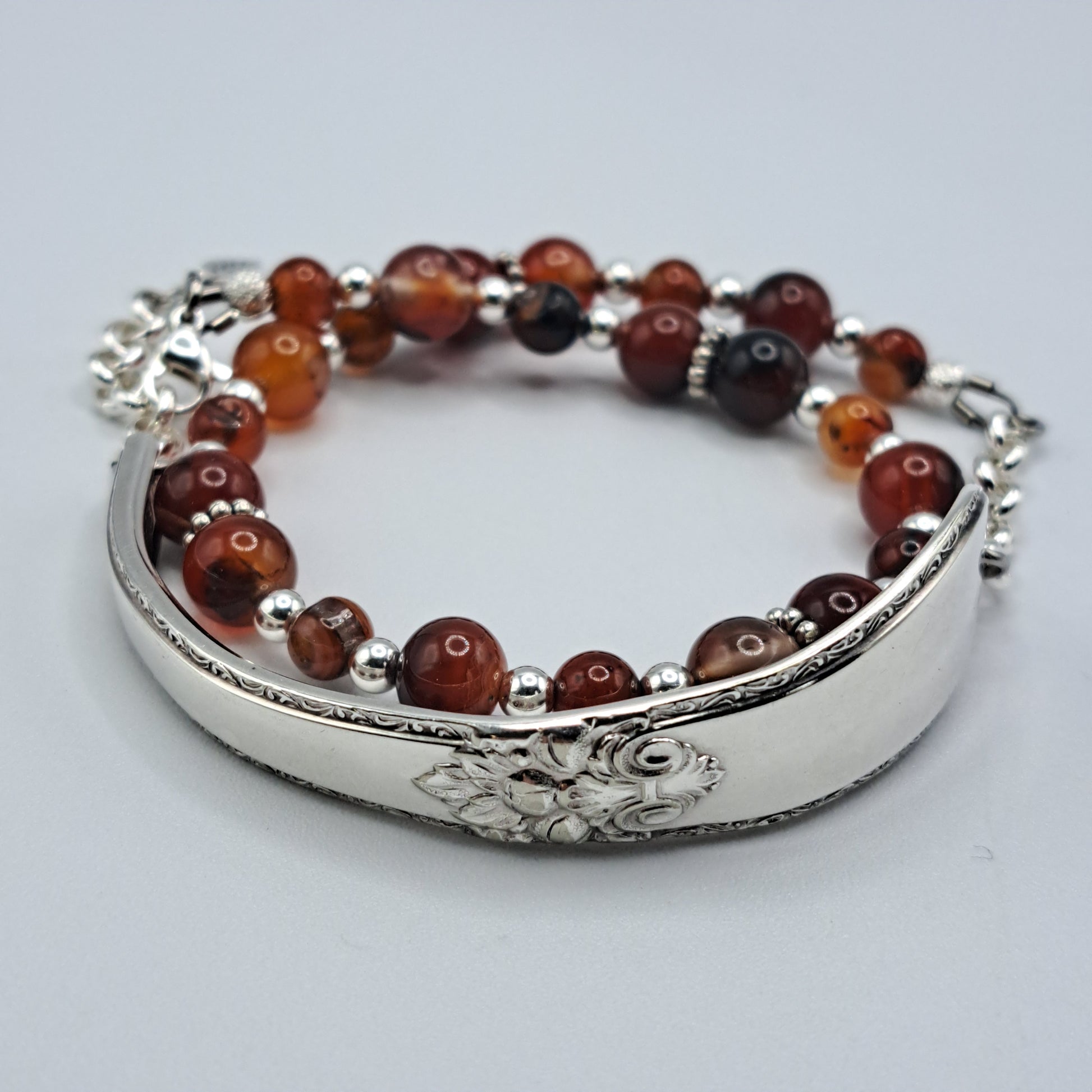 Handmade vintage silverware bracelet made from Adoration 1939 pattern silverplated handles with fire agate gemstone beads