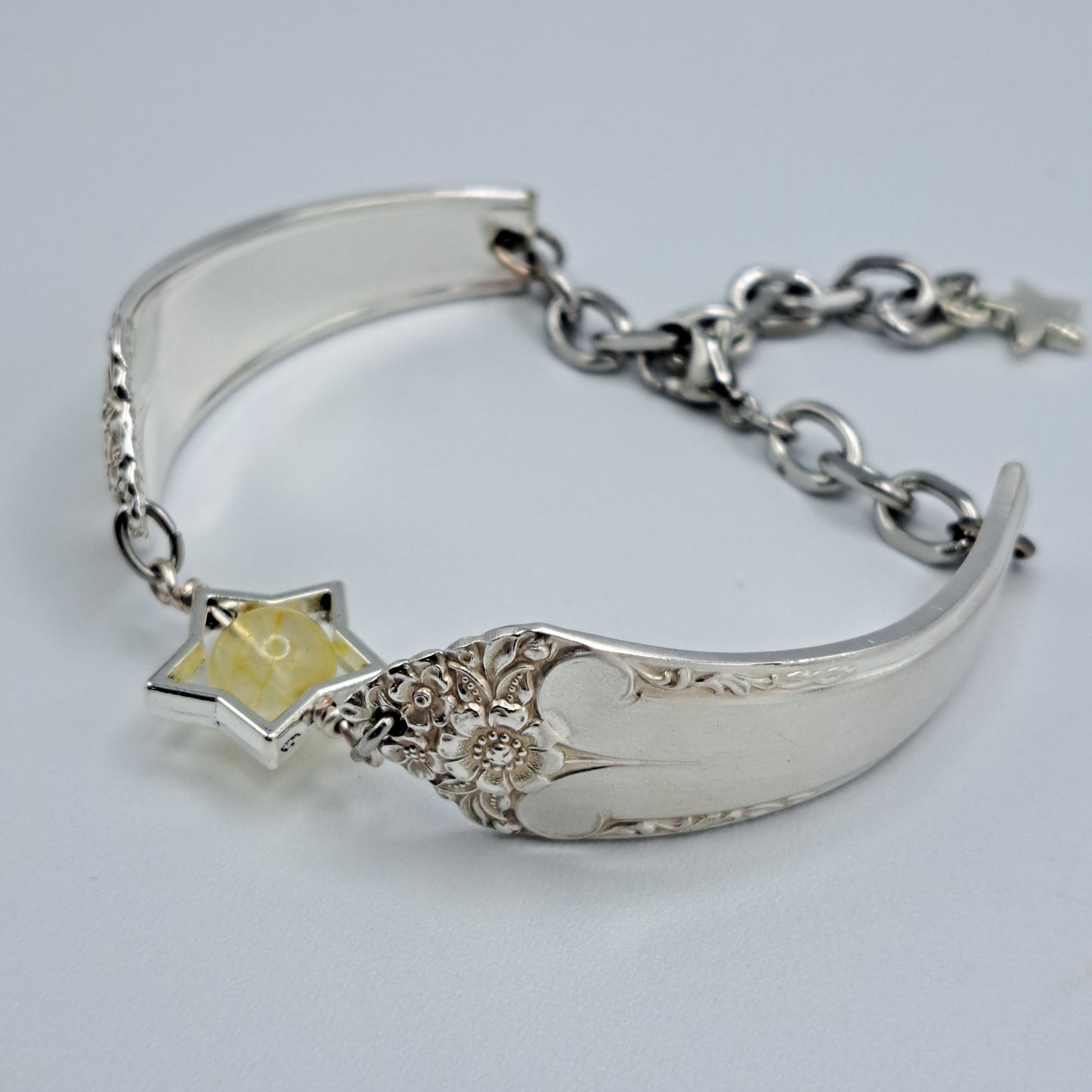 Handmade vintage silverware bracelet made from Starlight 1950 pattern silverplated handles with citrine gemstone center