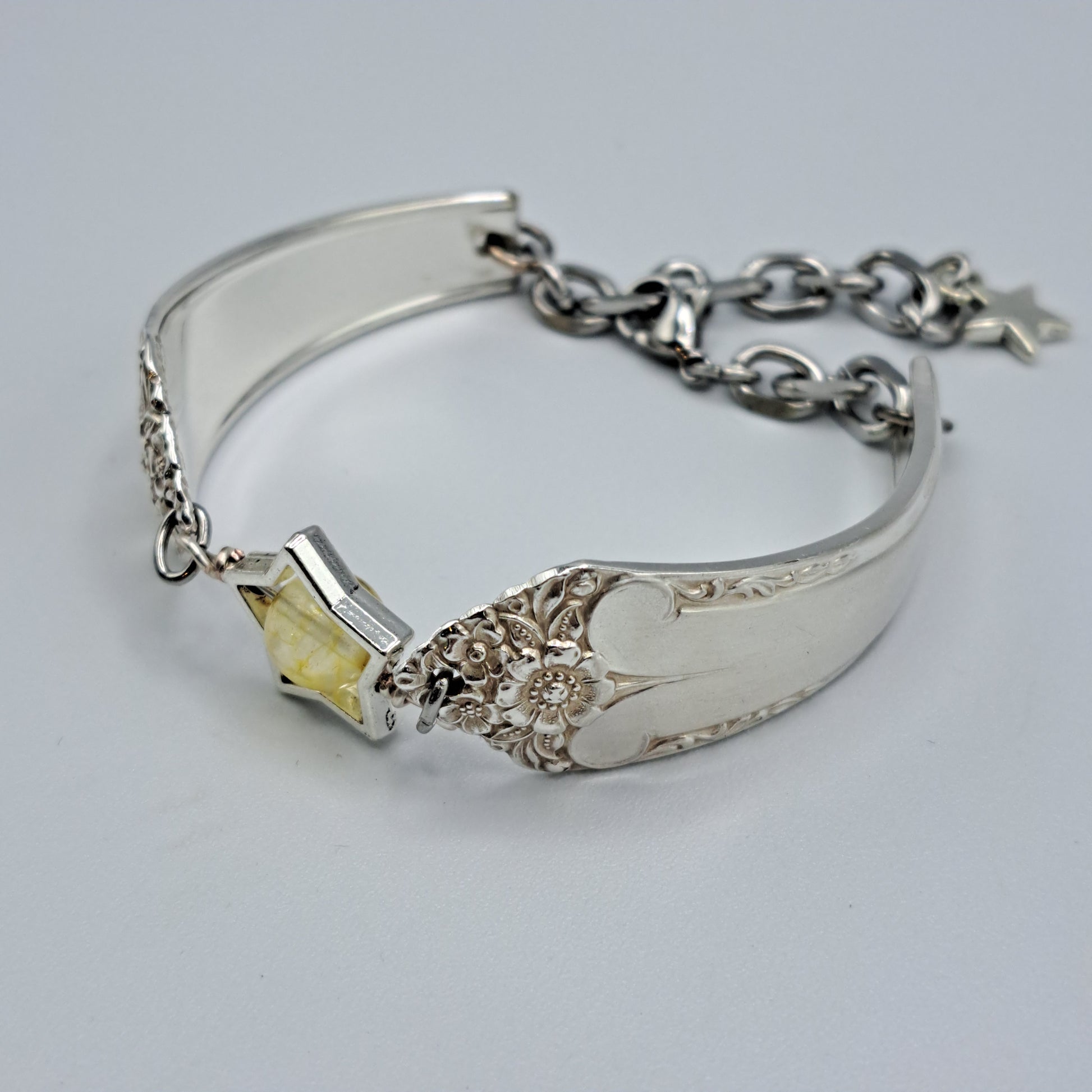 Handmade vintage silverware bracelet made from Starlight 1950 pattern silverplated handles with citrine gemstone center
