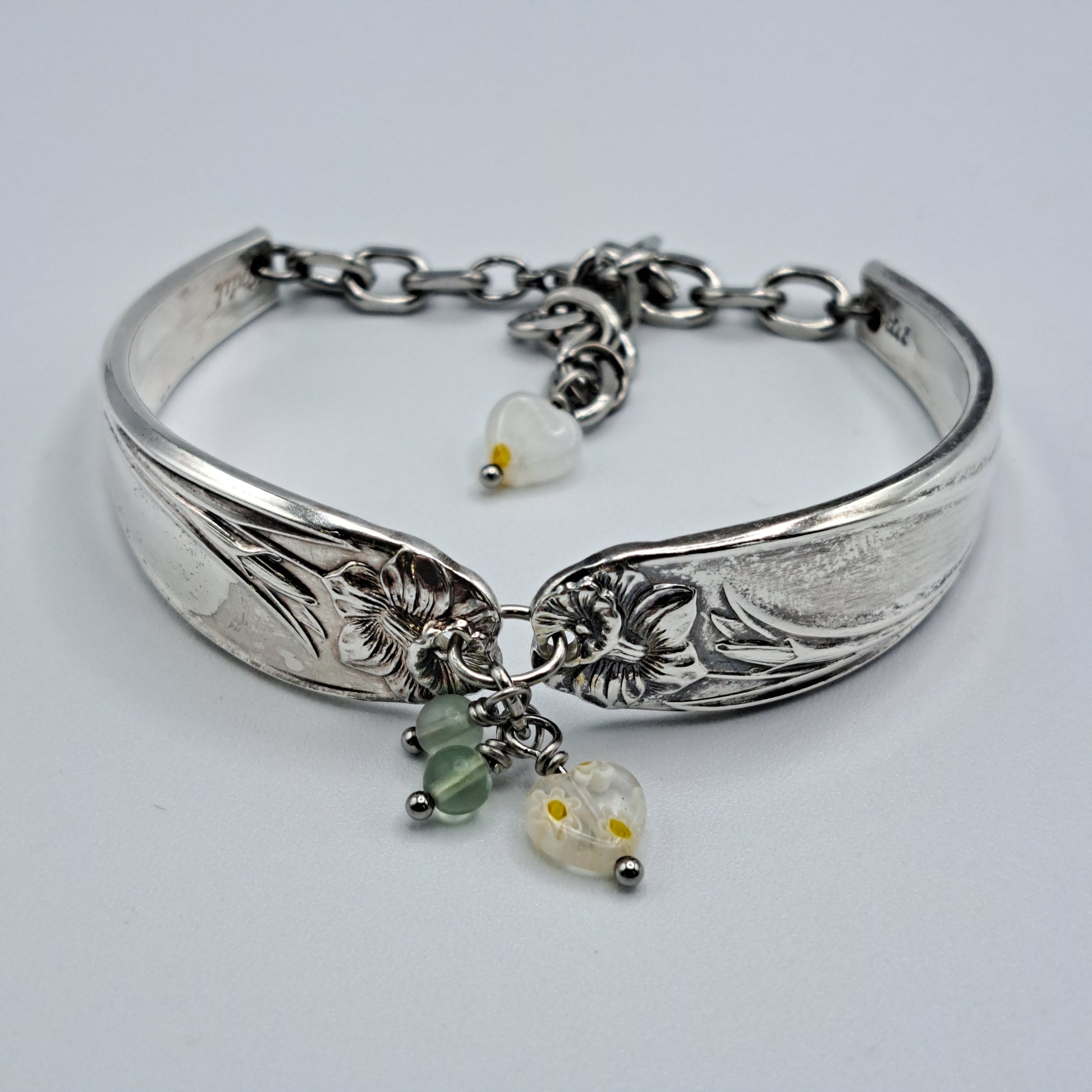 Handmade vintage silverware bracelet made from Daffodil 1950 pattern silverplated handles with center charm 