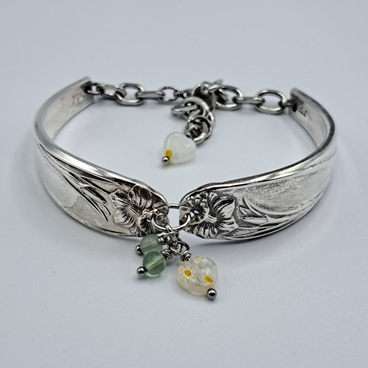 Handmade vintage silverware bracelet made from Daffodil 1950 pattern silverplated handles with center charm 
