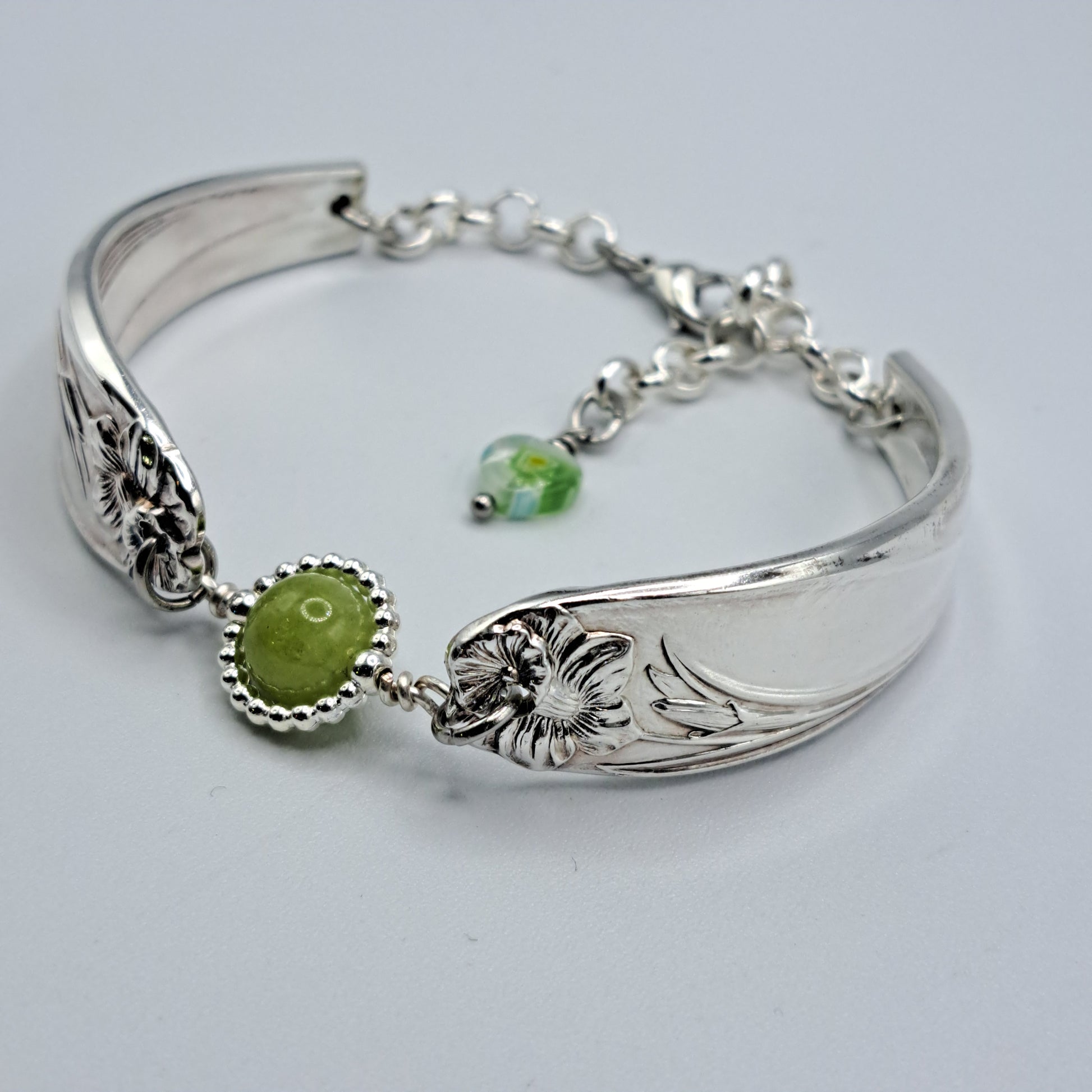 Handmade vintage silverware bracelet made from Daffodil 1950 pattern silverplated handles with center charm 