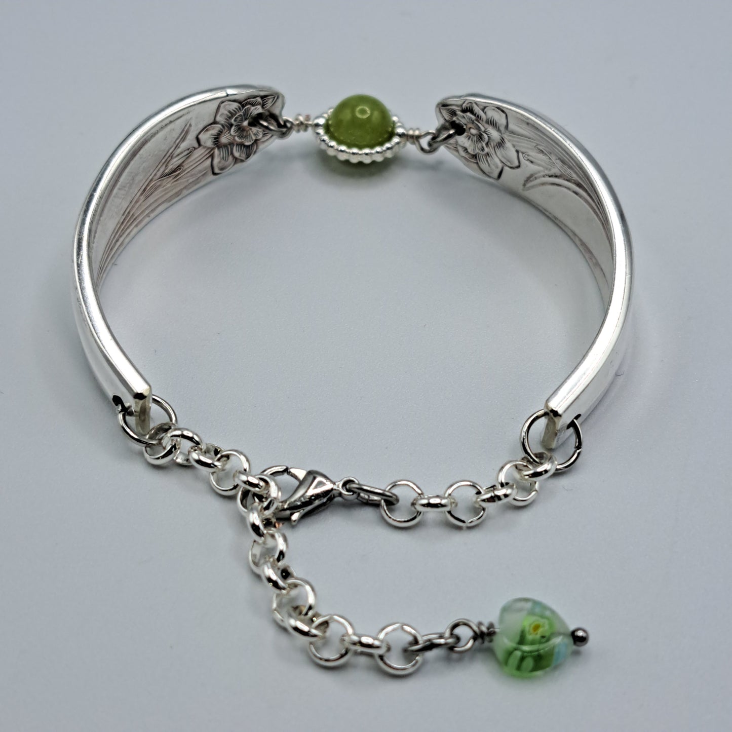 Handmade vintage silverware bracelet made from Daffodil 1950 pattern silverplated handles with center charm 
