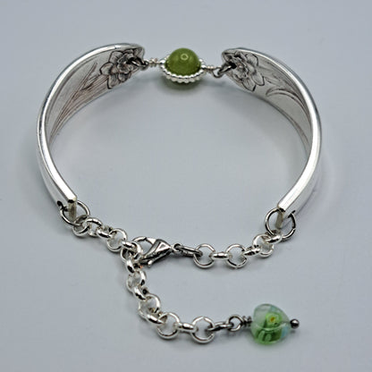 Handmade vintage silverware bracelet made from Daffodil 1950 pattern silverplated handles with center charm 