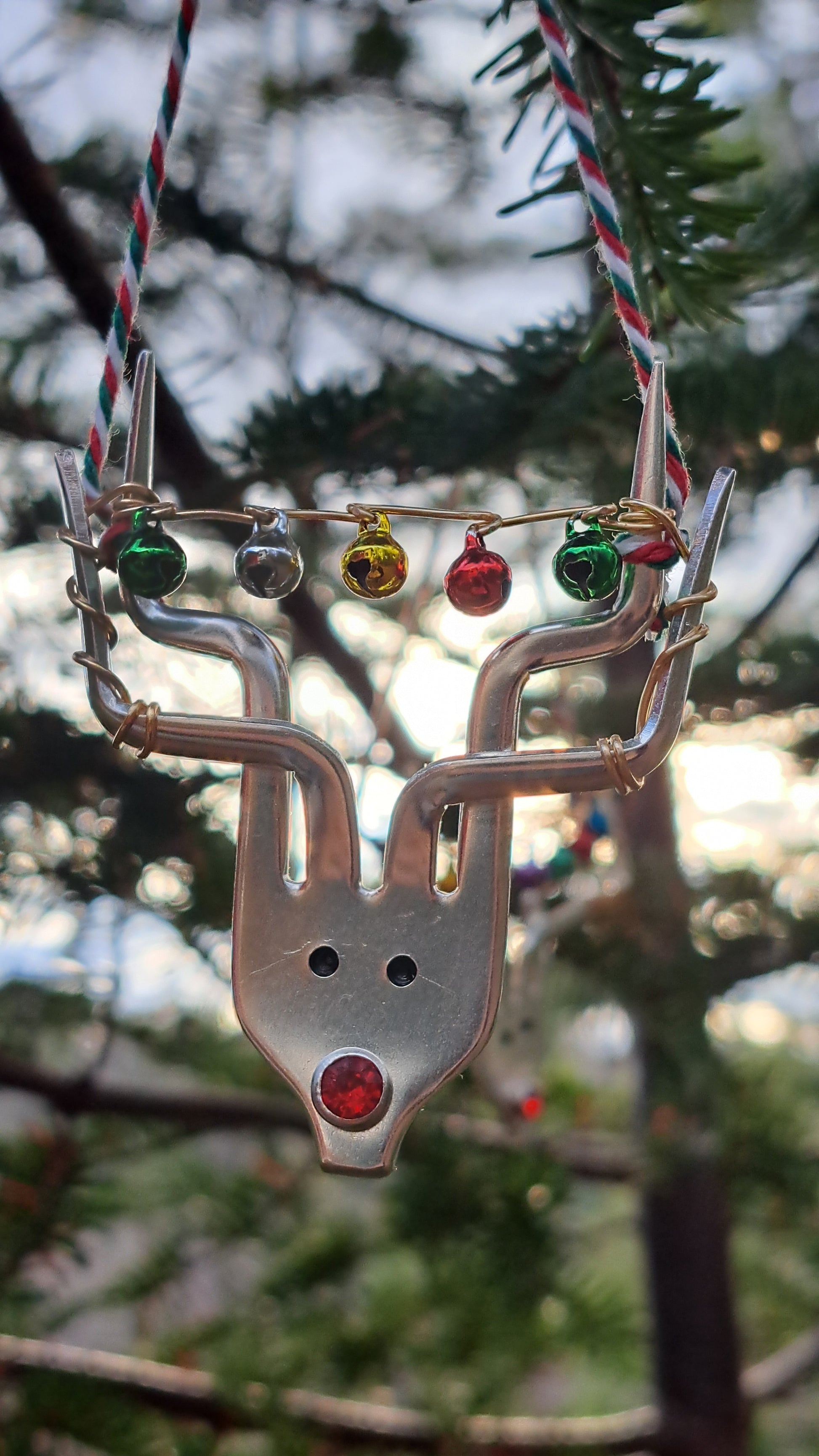 Handmade vintage silverware Christmas Ornament made from a fork shaped as a reindeer with christmas bells in antlers
