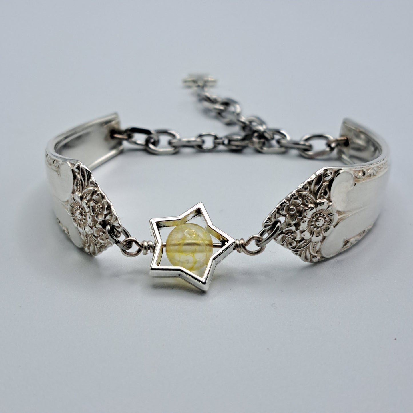 Handmade vintage silverware bracelet made from Starlight 1950 pattern silverplated handles with citrine gemstone center
