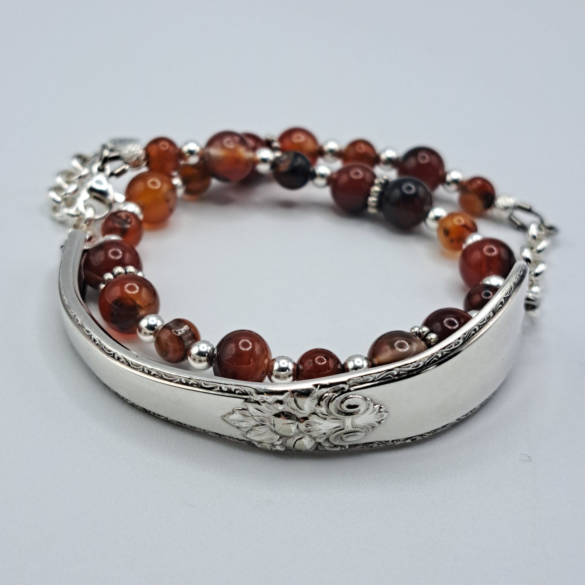 Handmade vintage silverware bracelet made from Adoration 1939 pattern silverplated handles with fire agate gemstone beads