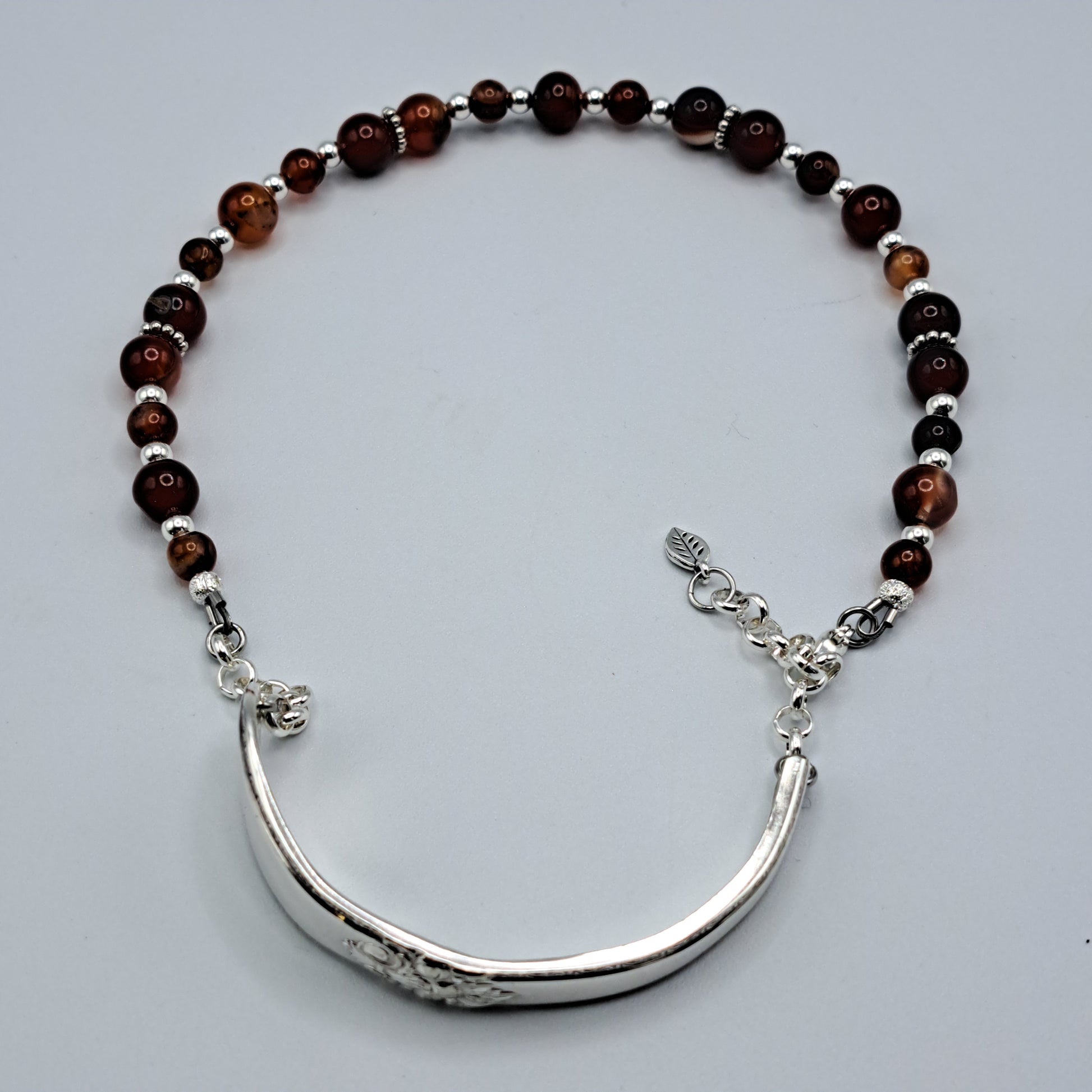 Handmade vintage silverware bracelet made from Adoration 1939 pattern silverplated handles with fire agate gemstone beads