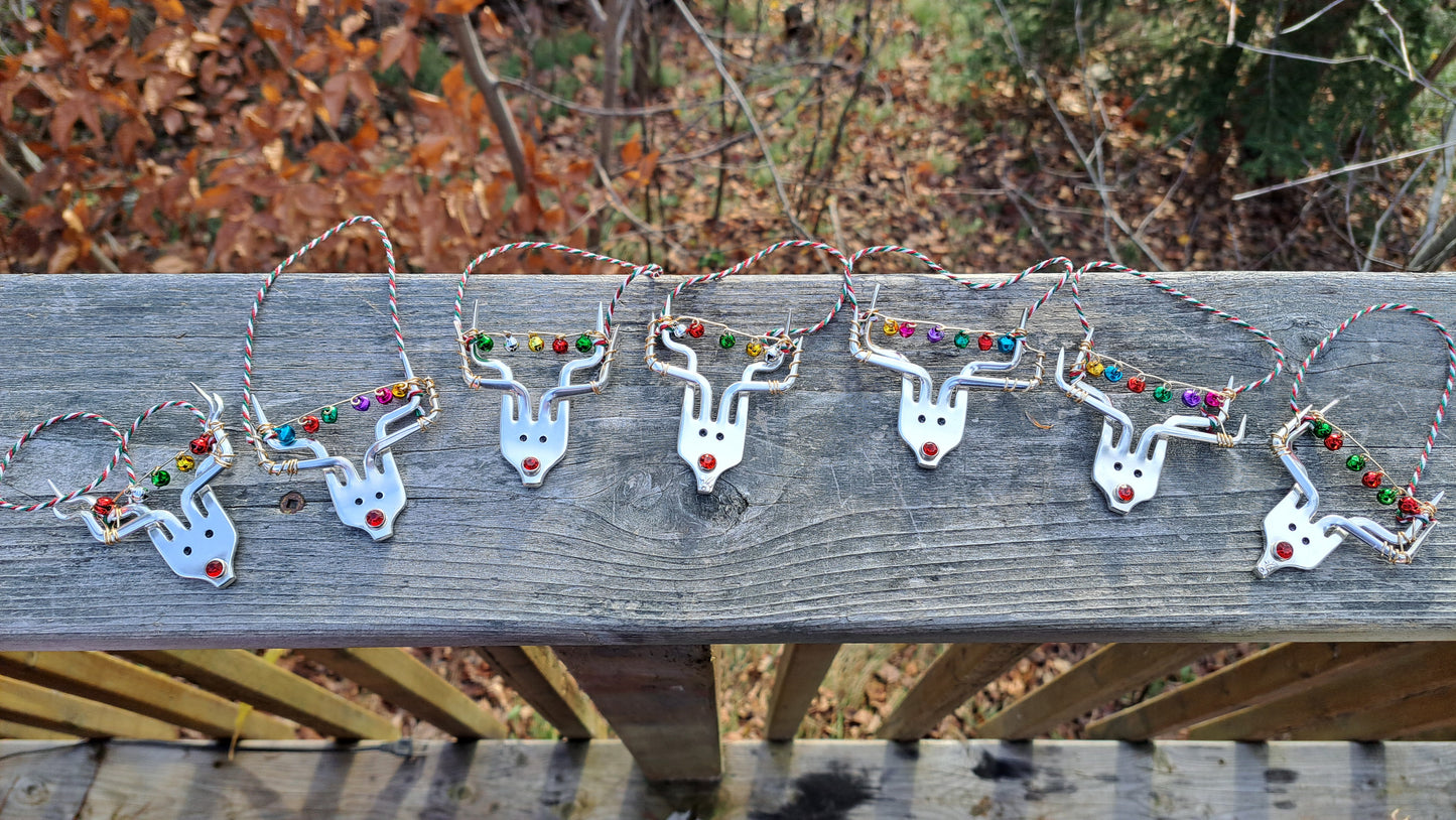 Handmade vintage silverware Christmas Ornament made from a fork shaped as a reindeer with christmas bells in antlers