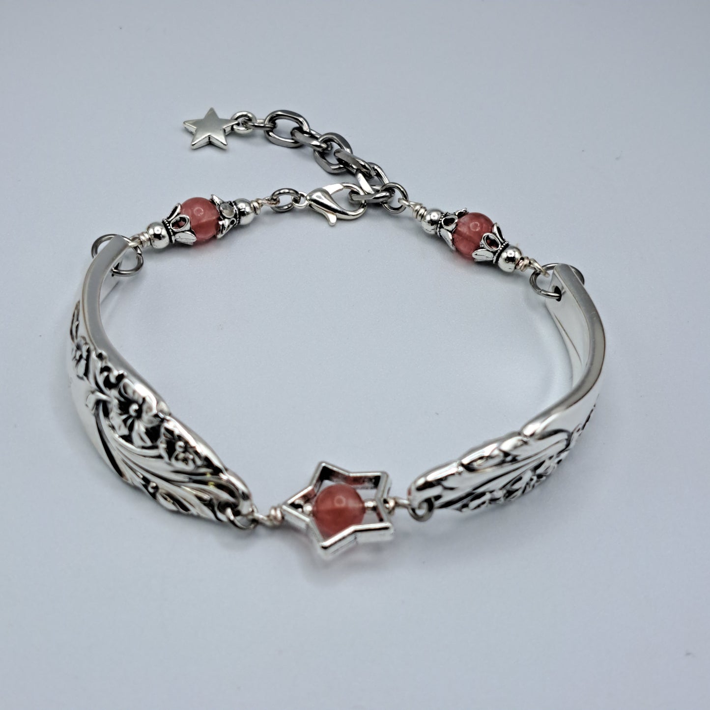 Handmade vintage silverware bracelet made from Evening Star 1950 silverplated handles with center cherry quartz and side beads