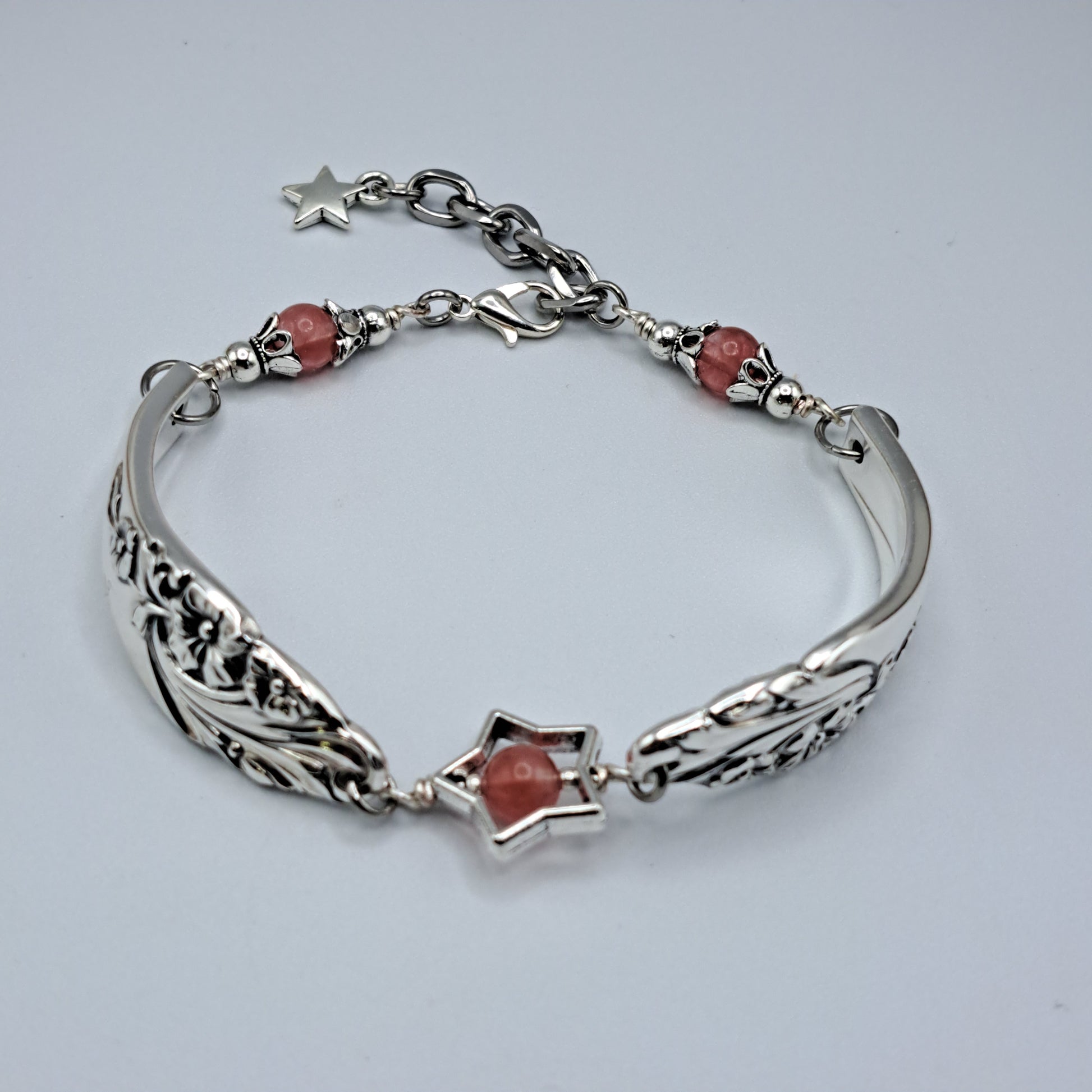 Handmade vintage silverware bracelet made from Evening Star 1950 silverplated handles with center cherry quartz and side beads