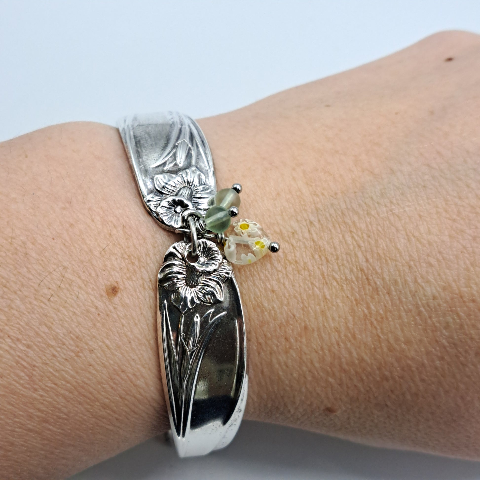 Handmade vintage silverware bracelet made from Daffodil 1950 pattern silverplated handles with center charm 