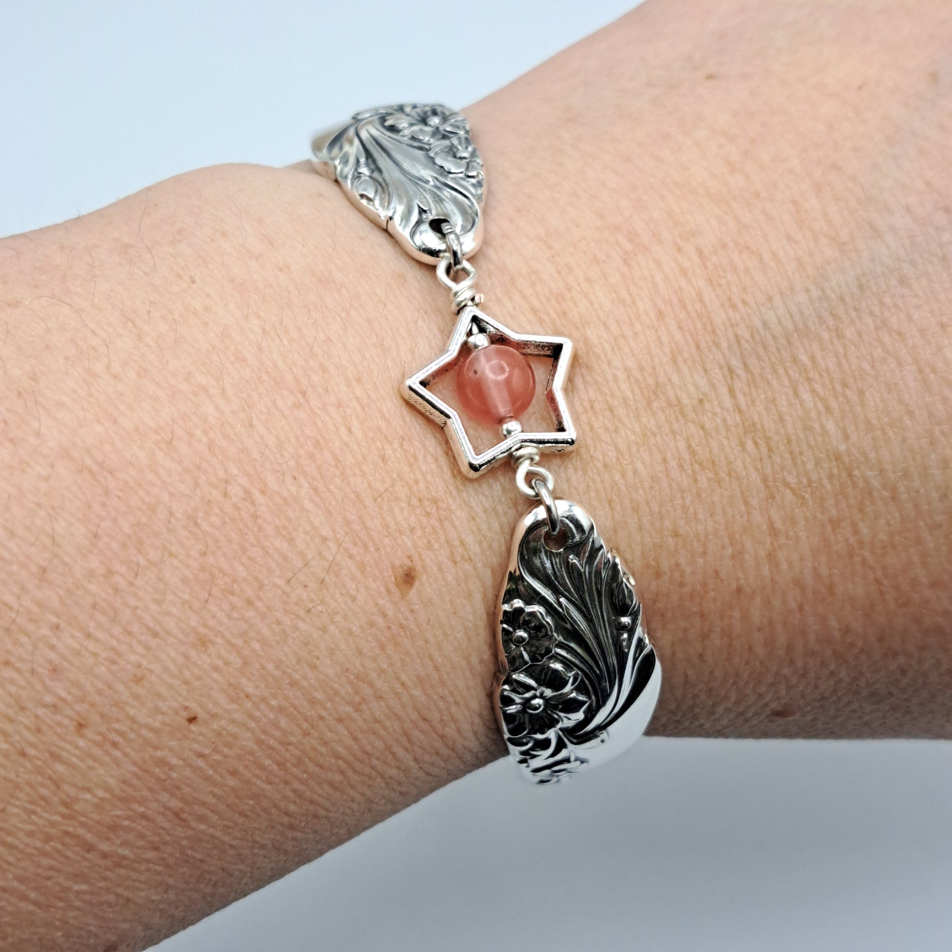 Handmade vintage silverware bracelet made from Evening Star 1950 silverplated handles with center cherry quartz and side beads