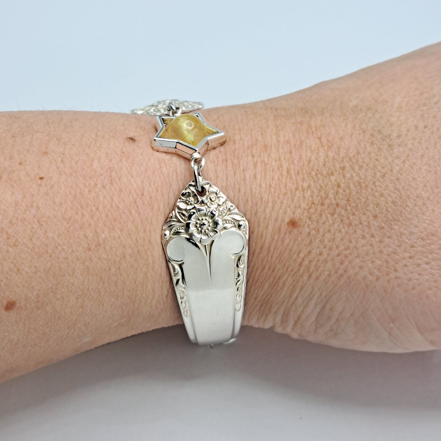 Handmade vintage silverware bracelet made from Starlight 1950 pattern silverplated handles with citrine gemstone center