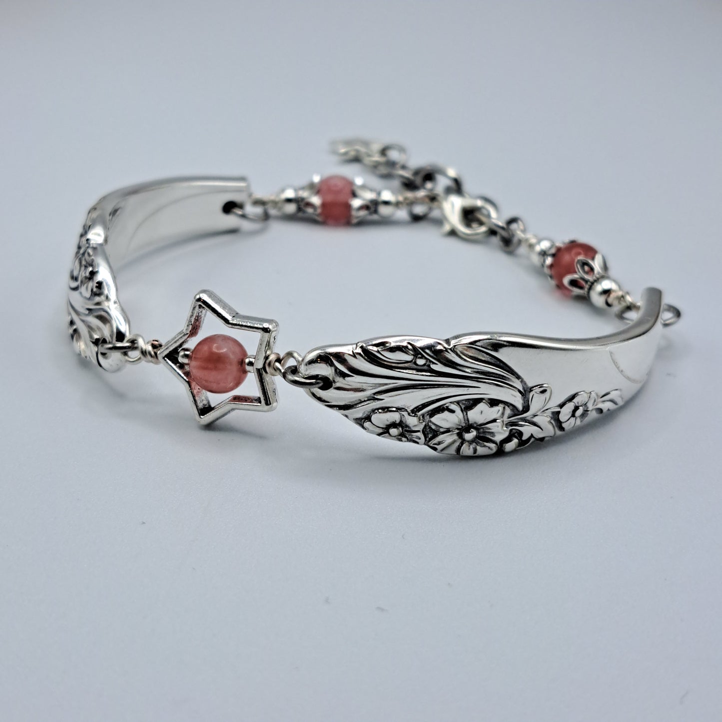 Handmade vintage silverware bracelet made from Evening Star 1950 silverplated handles with center cherry quartz and side beads