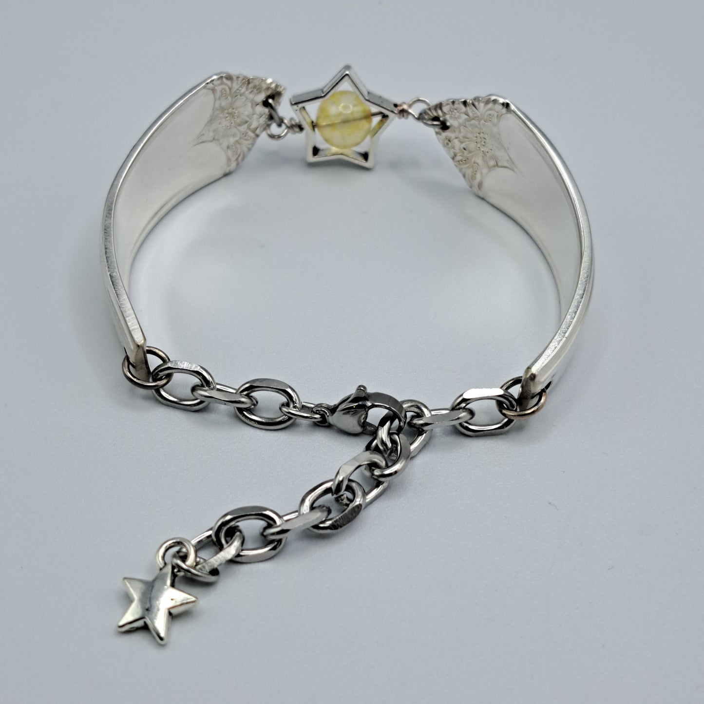 Handmade vintage silverware bracelet made from Starlight 1950 pattern silverplated handles with citrine gemstone center