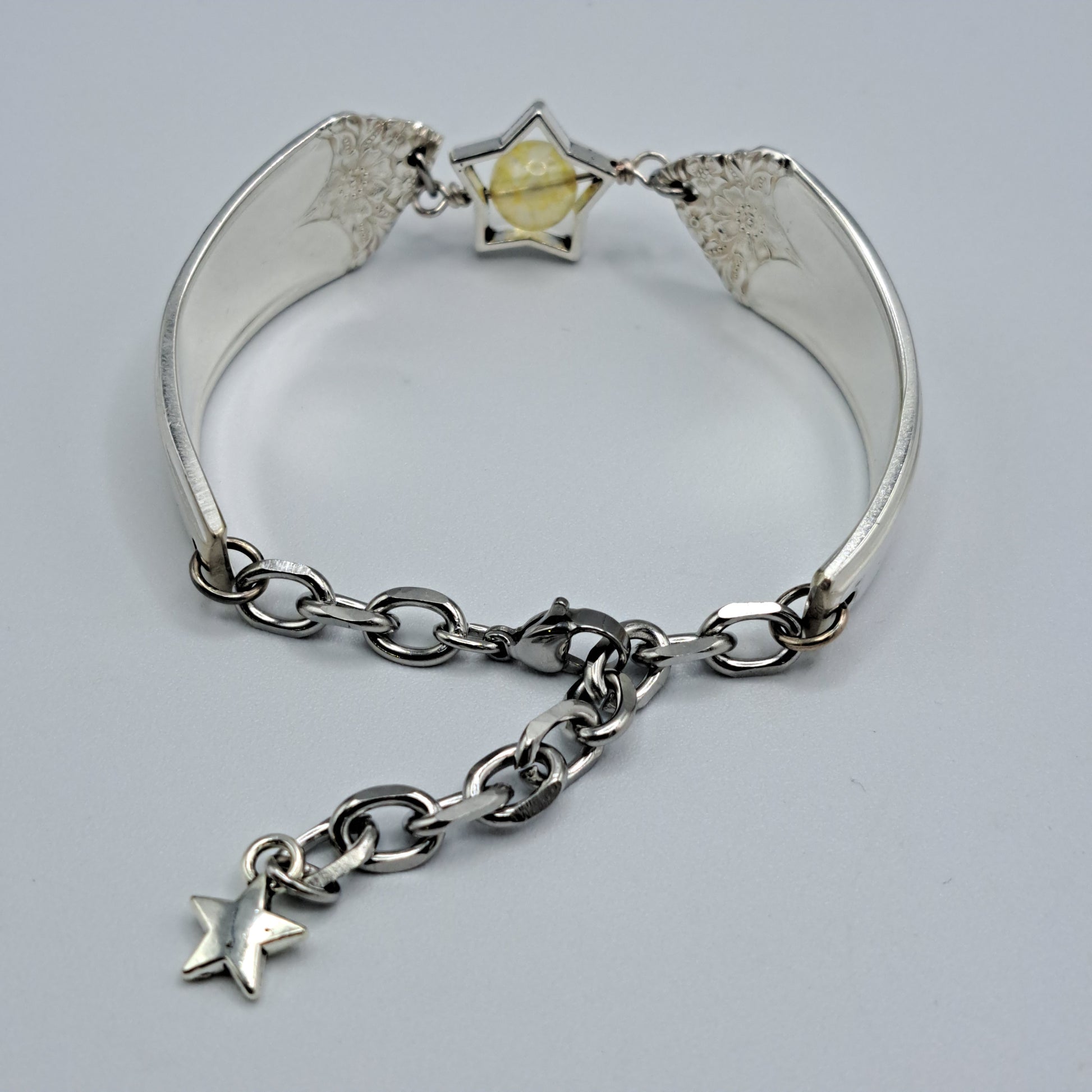 Handmade vintage silverware bracelet made from Starlight 1950 pattern silverplated handles with citrine gemstone center