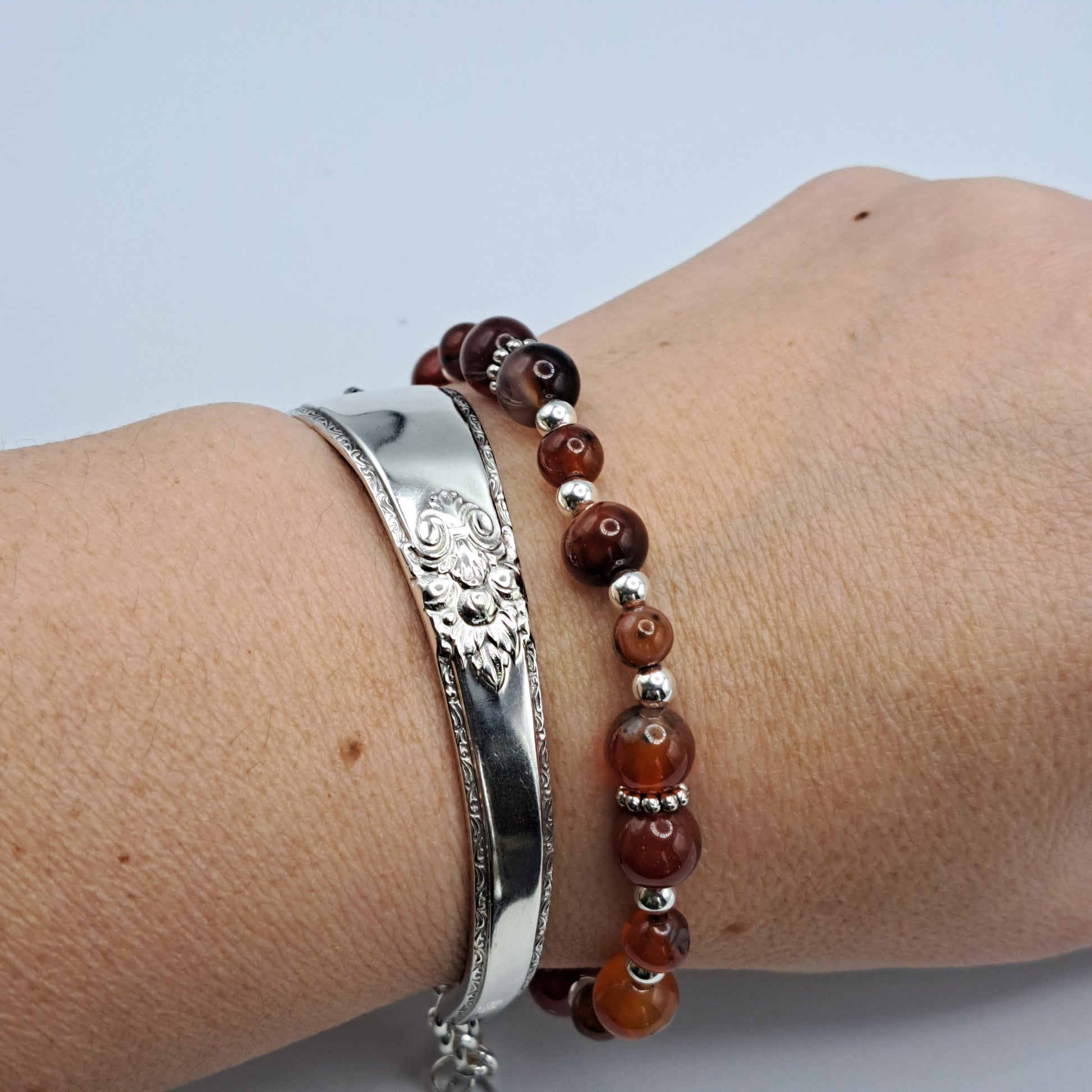 Handmade vintage silverware bracelet made from Adoration 1939 pattern silverplated handles with fire agate gemstone beads