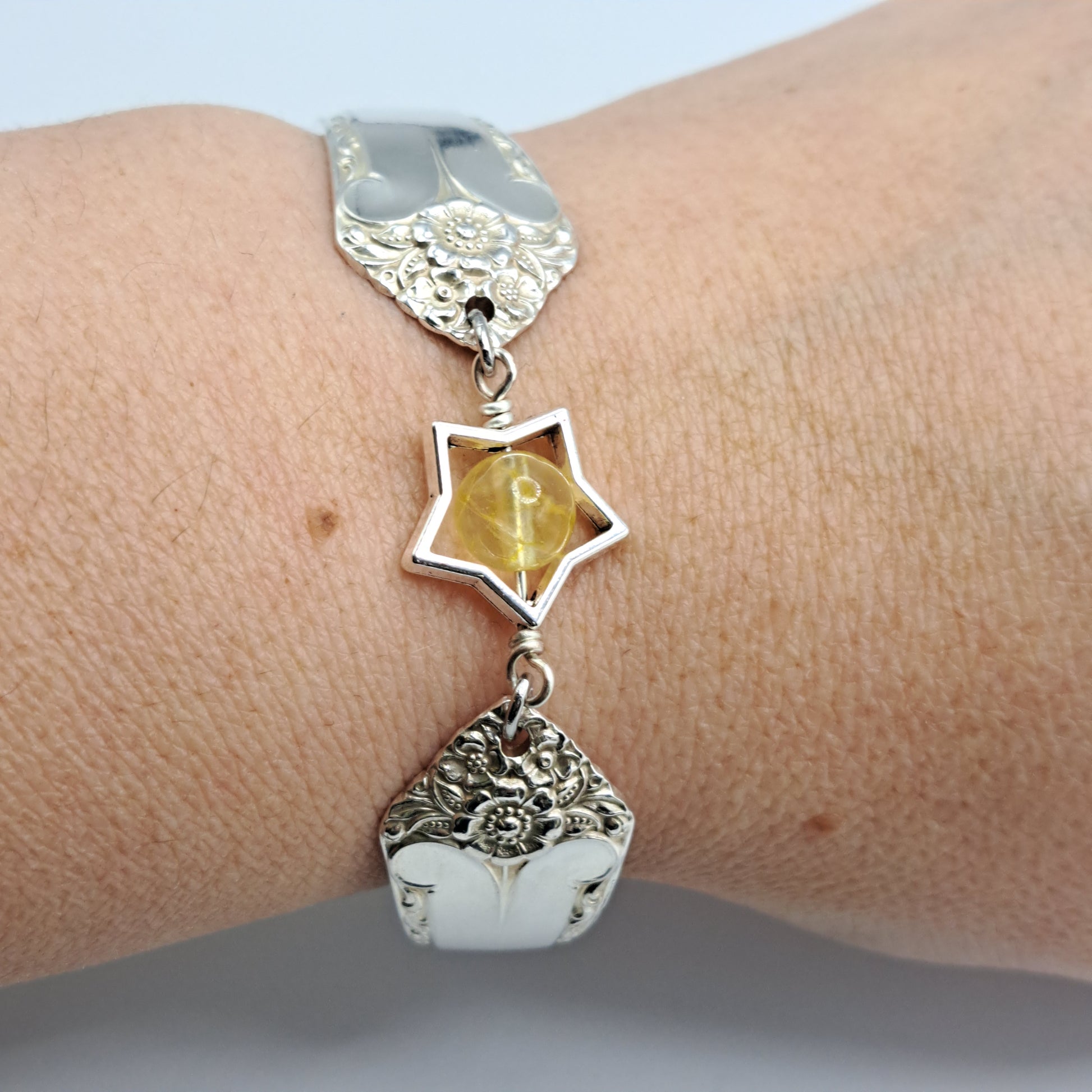 Handmade vintage silverware bracelet made from Starlight 1950 pattern silverplated handles with citrine gemstone center